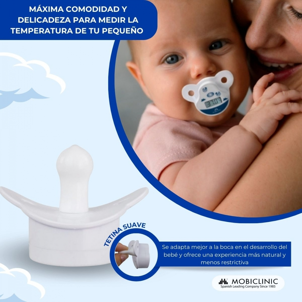 Un bebé con un chupete termómetro, sostenido por una mujer.