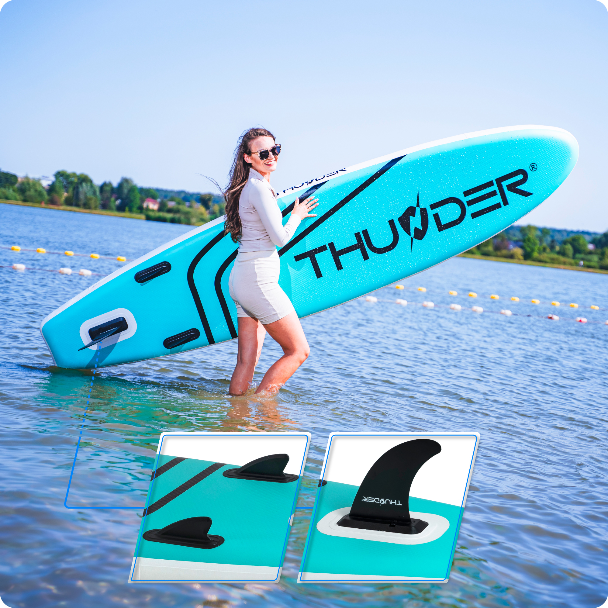 Kobieta w wodzie trzymająca niebieski paddleboard 'Thunder', zbliżenia dwóch płetw.