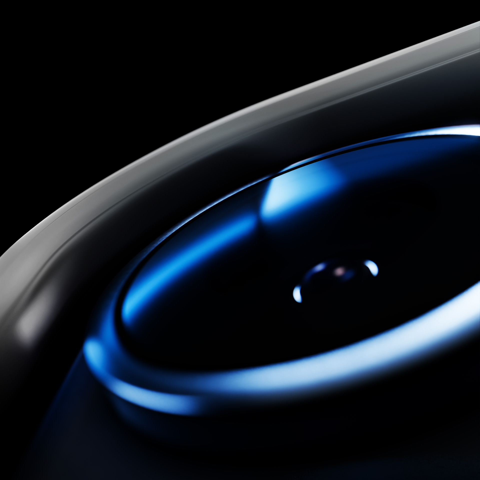 Abstrakcyjny zbliżenie czarnego obiektu z niebieskimi światłami i srebrnymi akcentami.