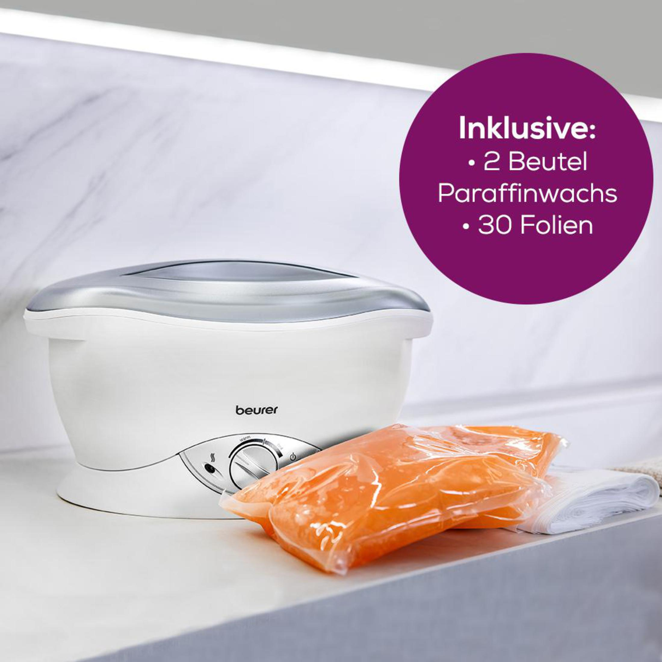 Ein weißer Paraffin-Wärmer mit silbernem Deckel, daneben orangefarbenes Wachs und Folien.