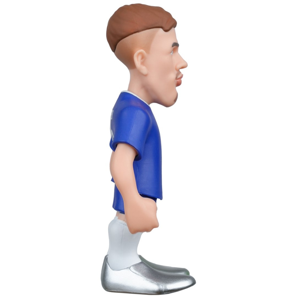 Niebieska figurka piłkarza z brązowymi włosami i srebrnymi butami.