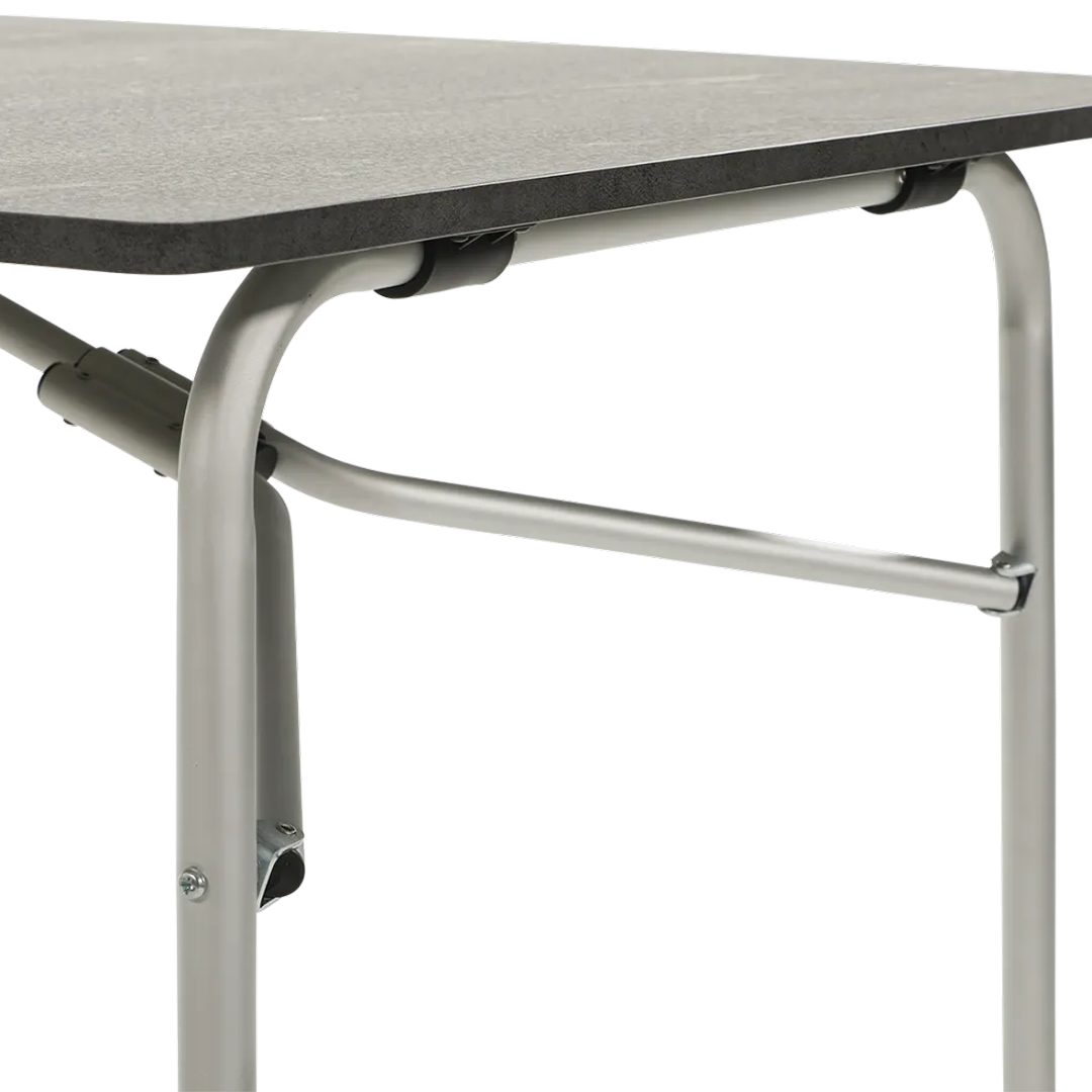 Close-up of a gray table with silver metal legs and crossbars.