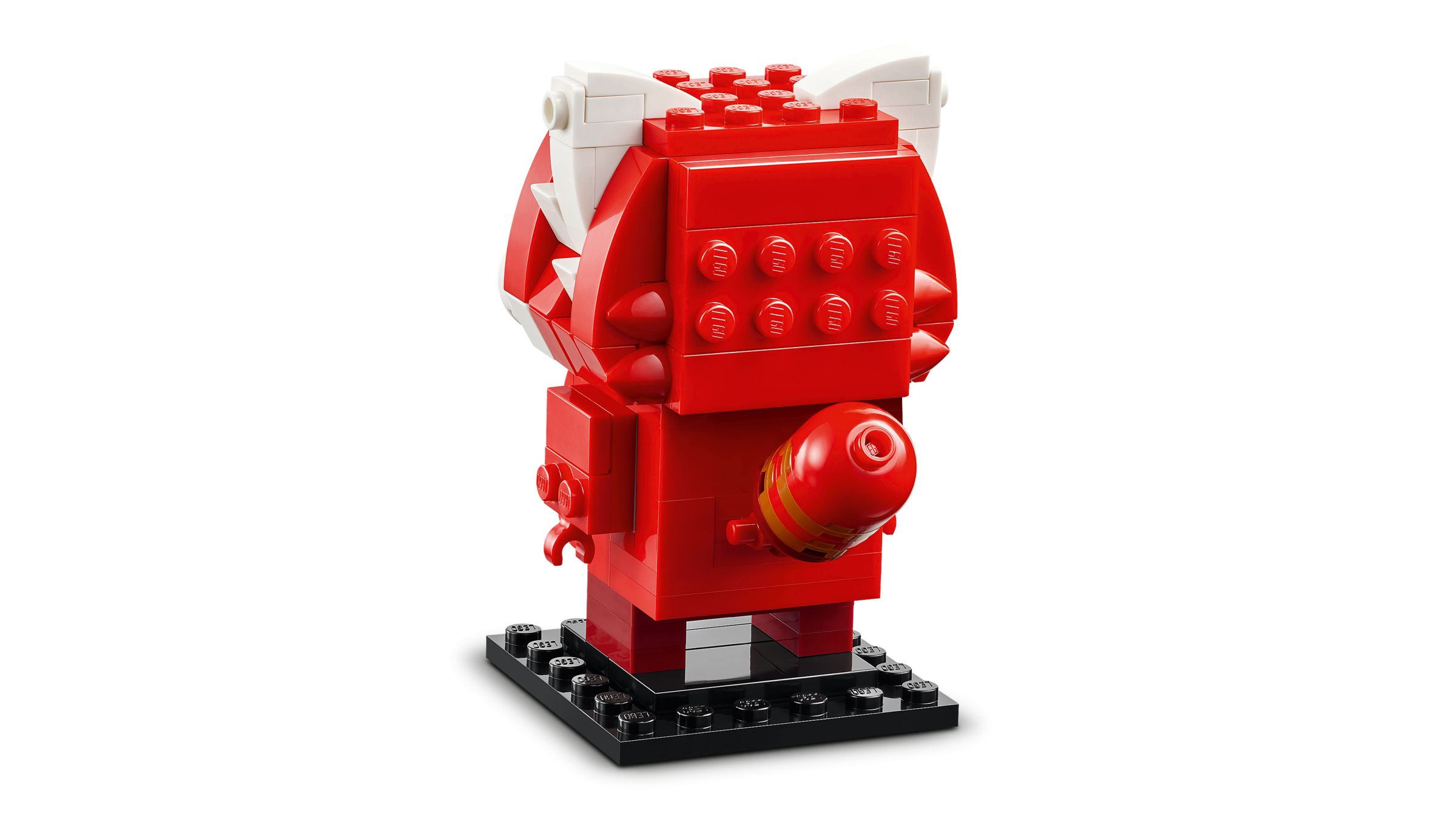 Ein roter Lego-Charakter mit weißen Ohren und Zähnen auf einem schwarzen Sockel.