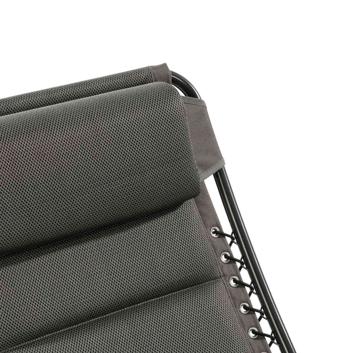Gray mesh fabric and padding on a black metal frame, secured with cords.