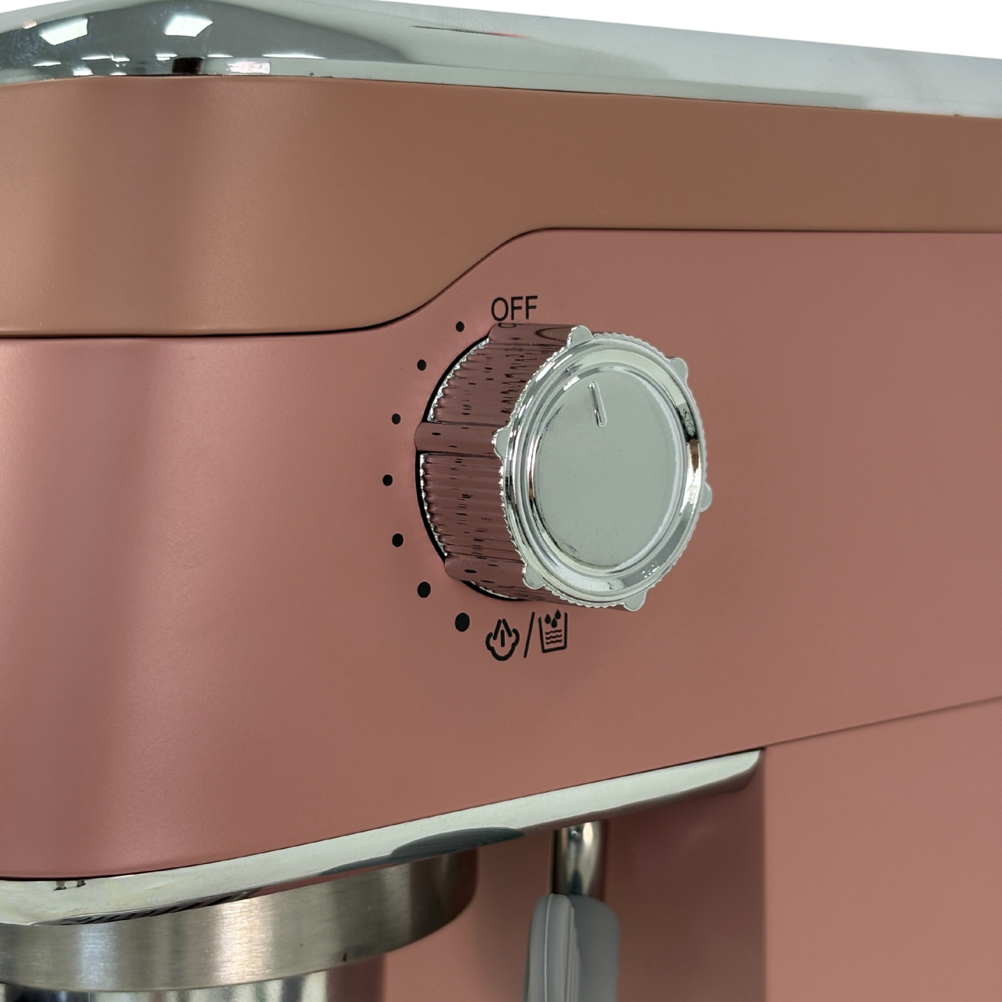 Un robot de cocina rosa dorado con dial plateado y símbolos de vapor, agua y hielo.