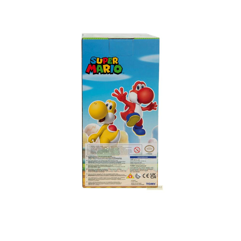 Boîte Super Mario avec des Yoshis rouges et jaunes. Nuages bleus dans le ciel.