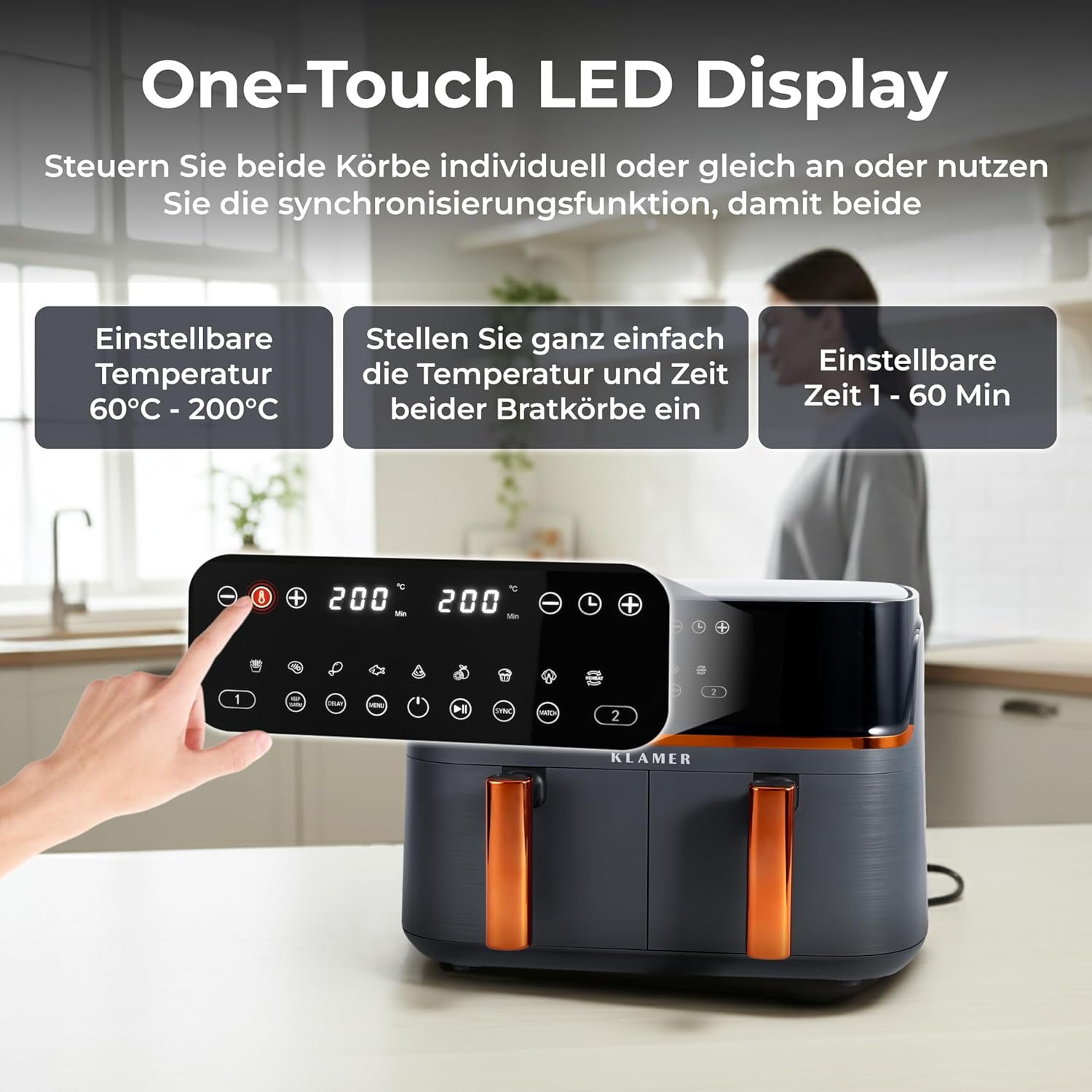 Ein schwarzer Doppel-Heißluftfritteuse mit orangefarbenen Griffen und LED-Display.