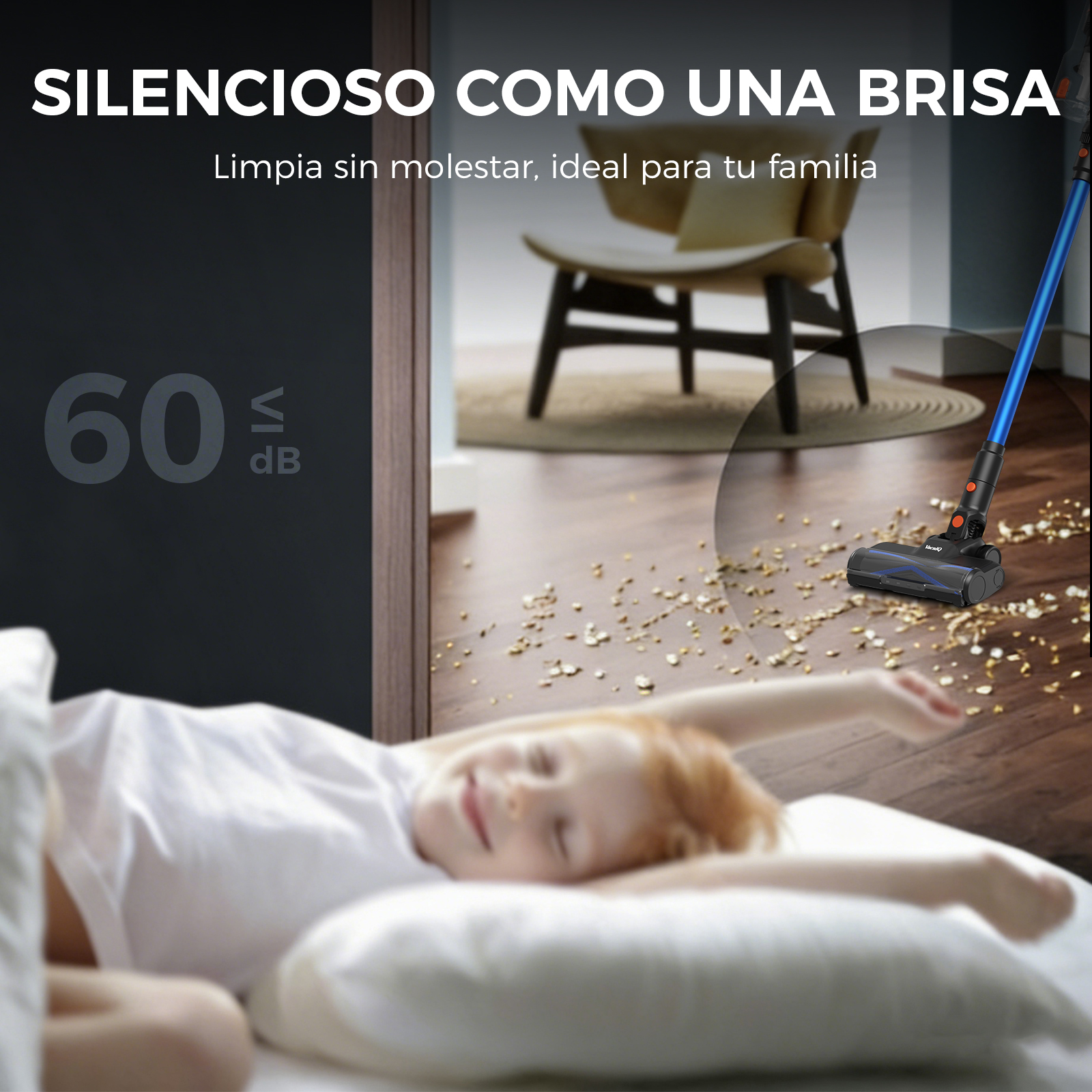 Una aspiradora azul limpia un suelo de madera mientras un niño duerme.