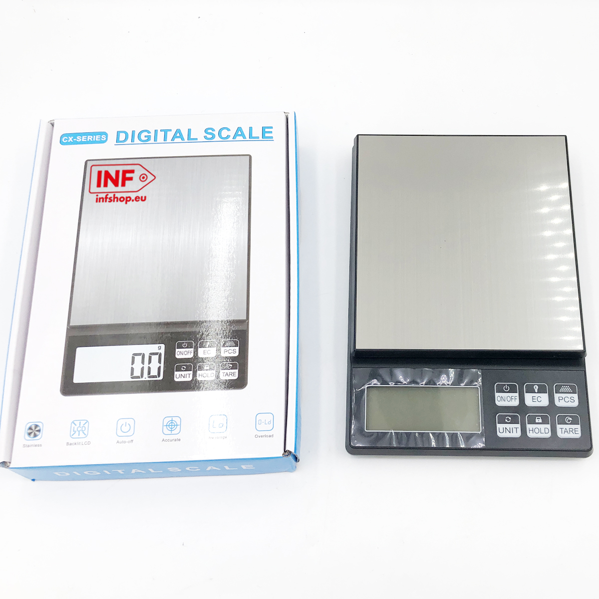Waga cyfrowa w pudełku i druga obok na białym tle.