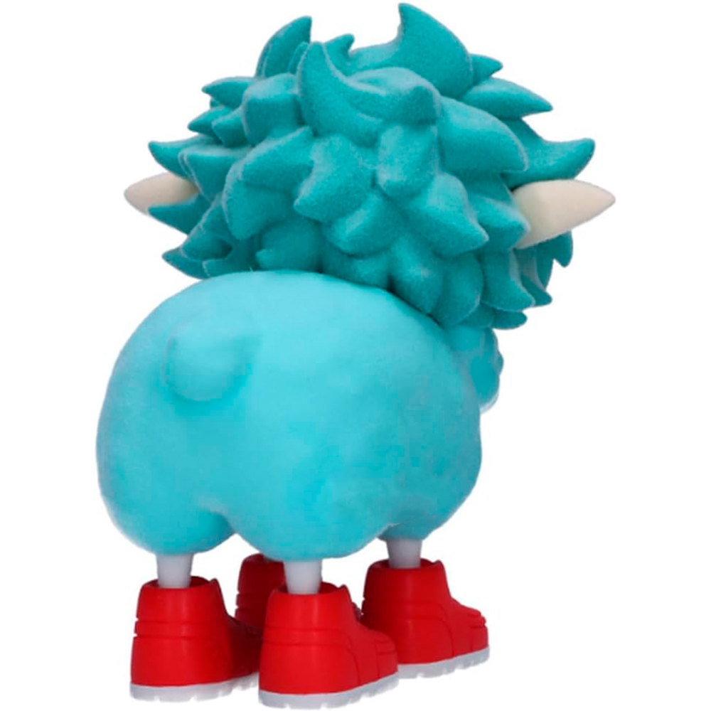 Un personaggio blu e peloso con scarpe rosse.