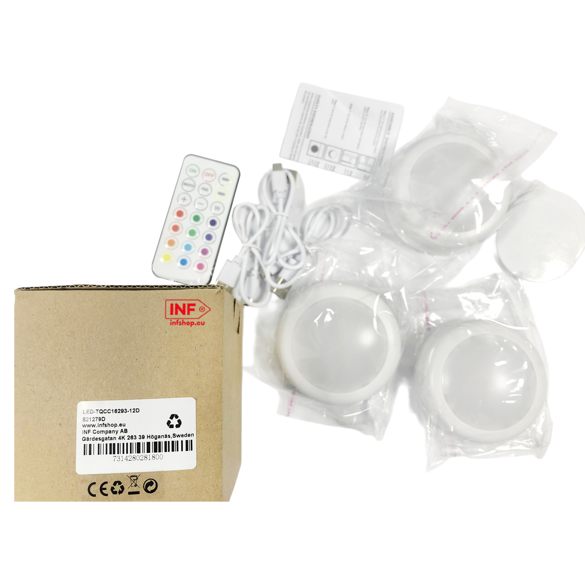 Een kartonnen doos, afstandsbediening, kabels en drie LED-lampen in plastic.