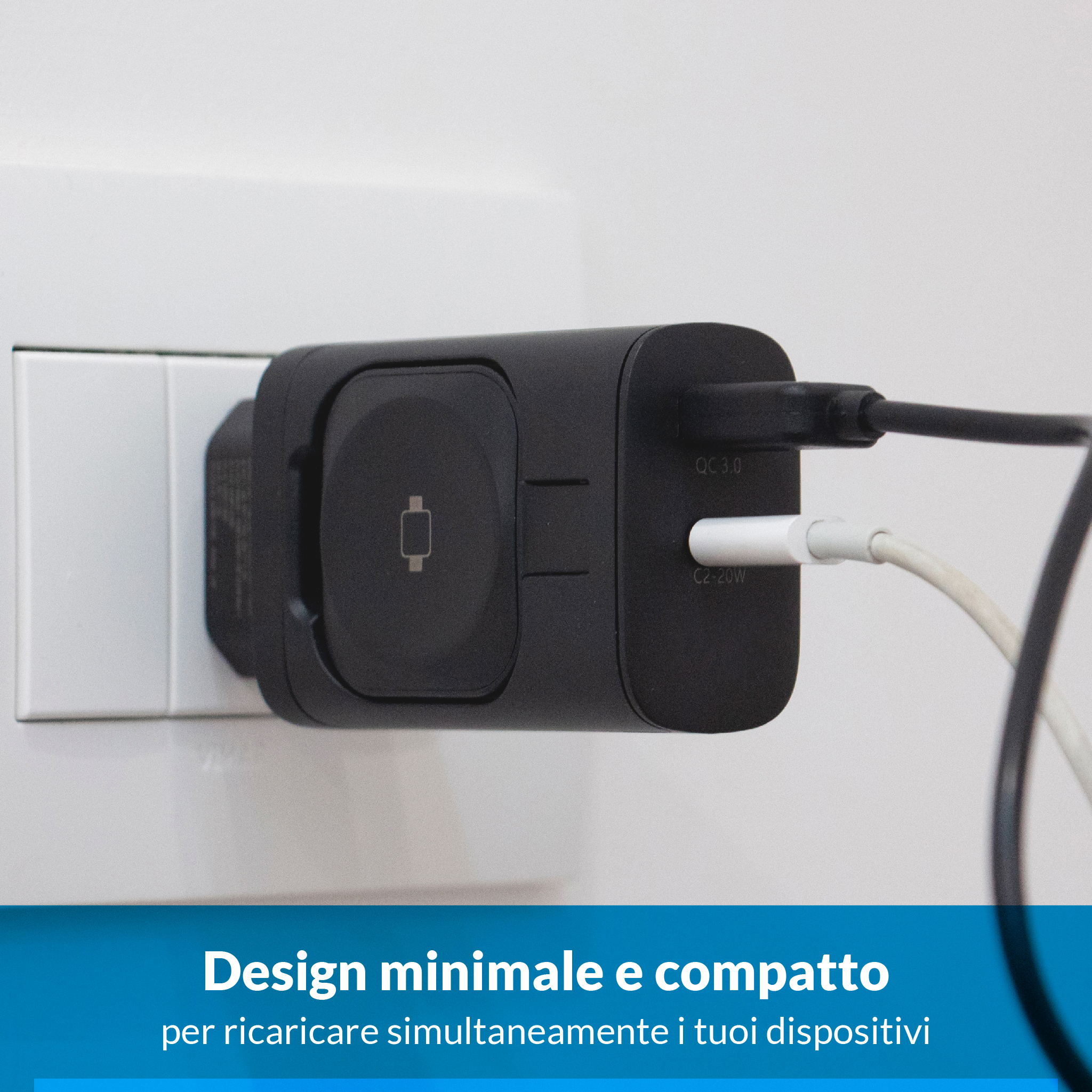 Un caricatore nero con due cavi collegati a una presa a muro bianca.