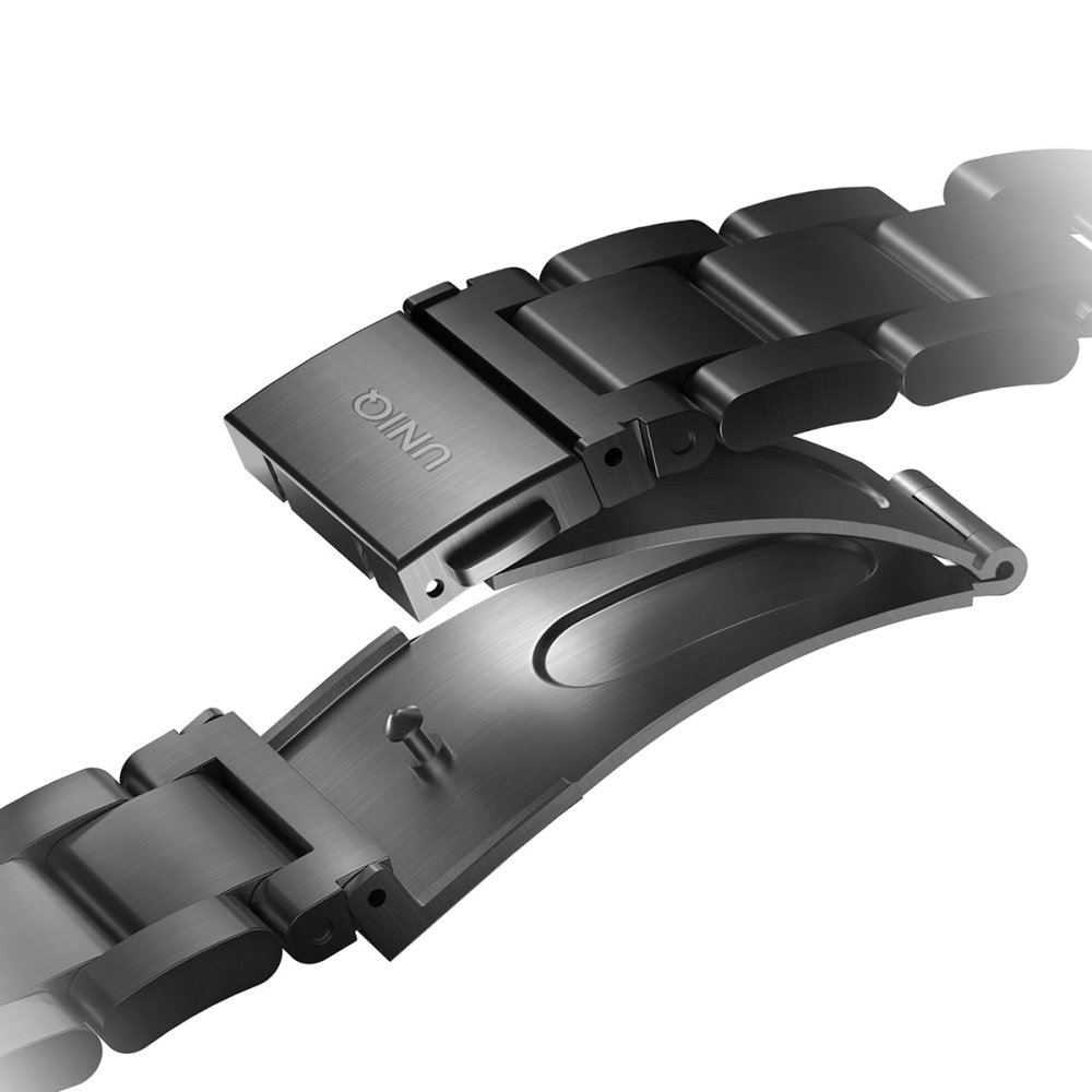 Açık tokalı, koyu renkli metal saat kayışı.