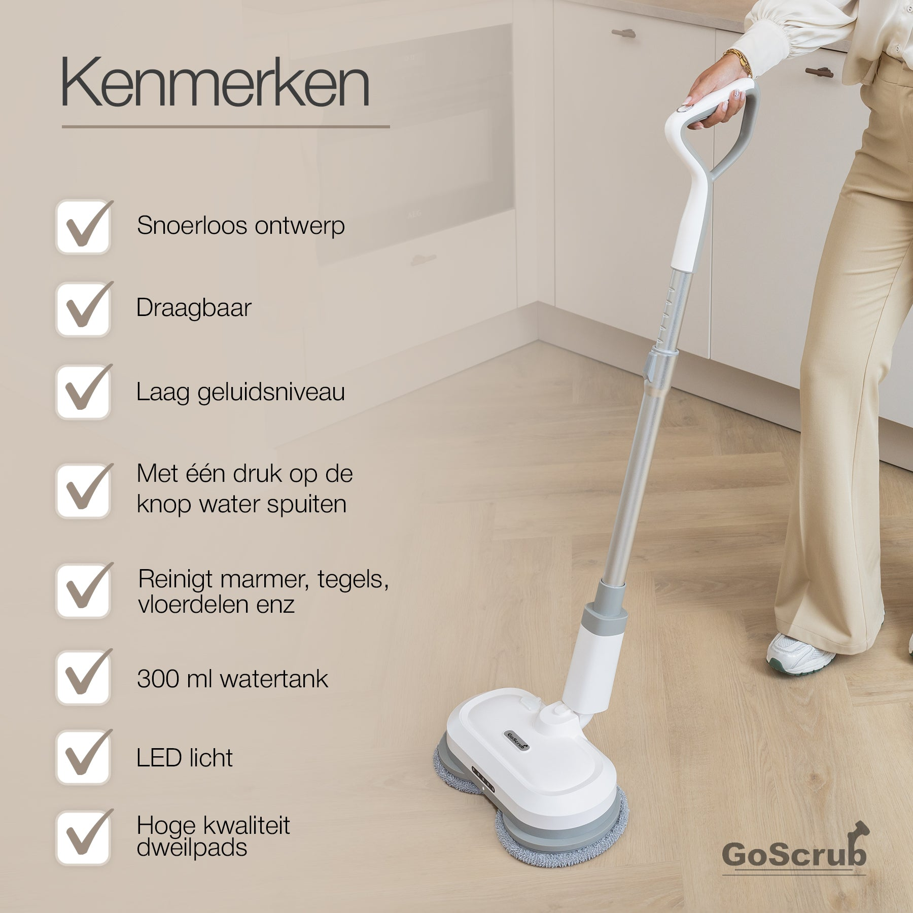 A cordless mop with blue details is held by a person in a kitchen setting.
