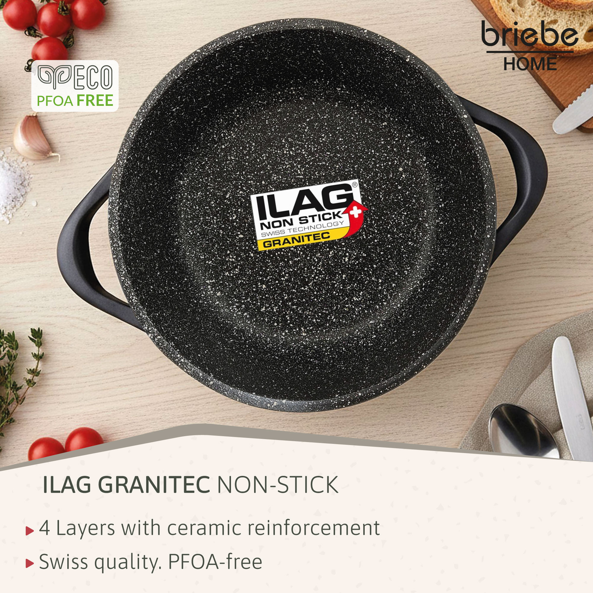Granit-Topf mit ILAG Granitec-Beschichtung und Griffen, daneben Kirschtomaten und Knoblauch.