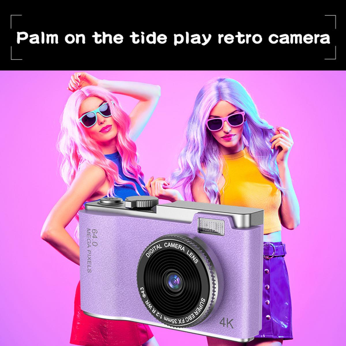 Zwei Frauen mit farbigen Haaren halten eine lila Digitalkamera, vor einem pinken Hintergrund.