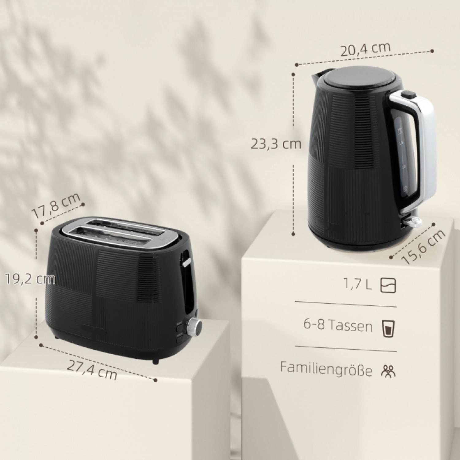 Schwarzer Toaster und Wasserkocher mit Maßangaben auf hellen Podesten.