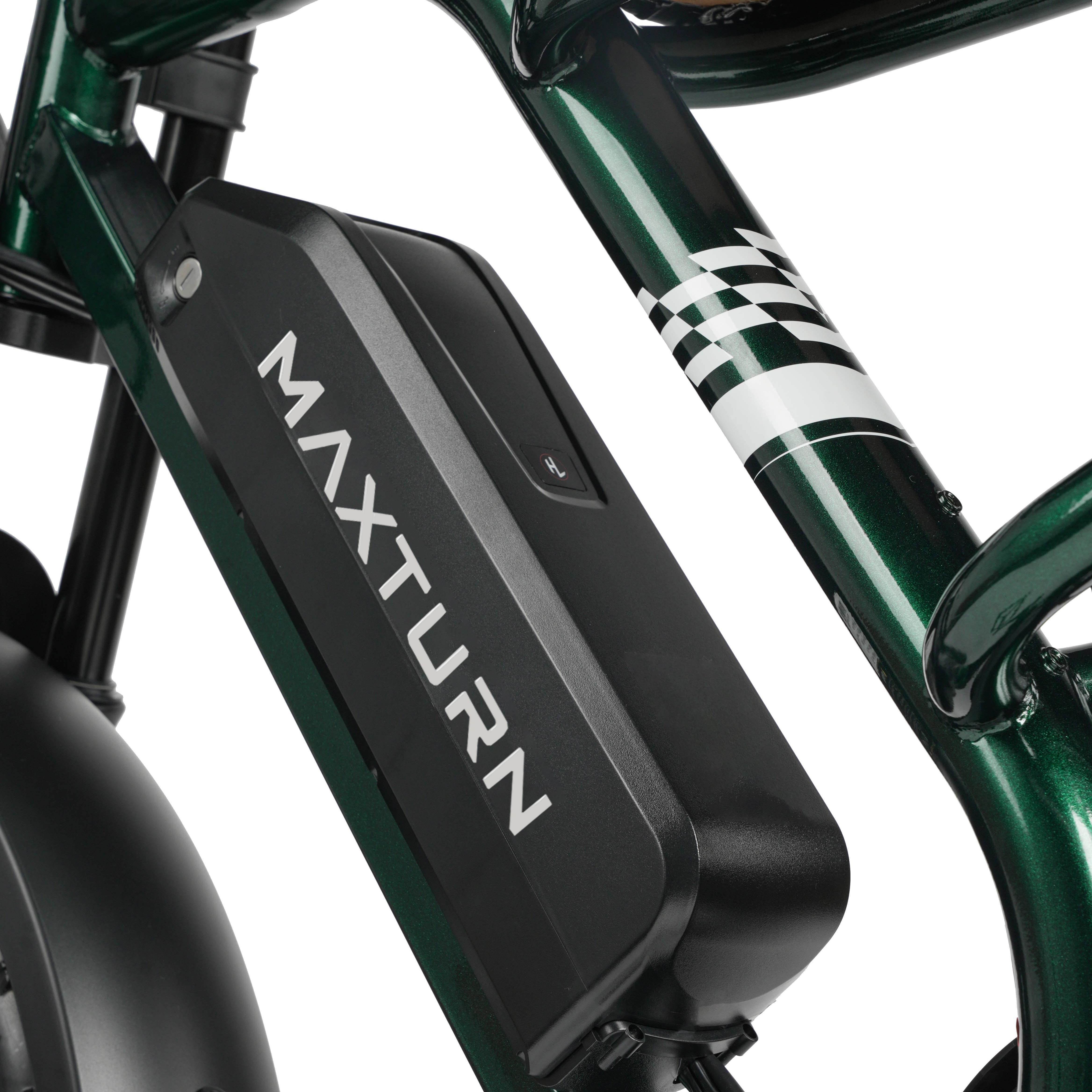 Zielony rower z czarną jednostką akumulatora z napisem "MAXTURN".