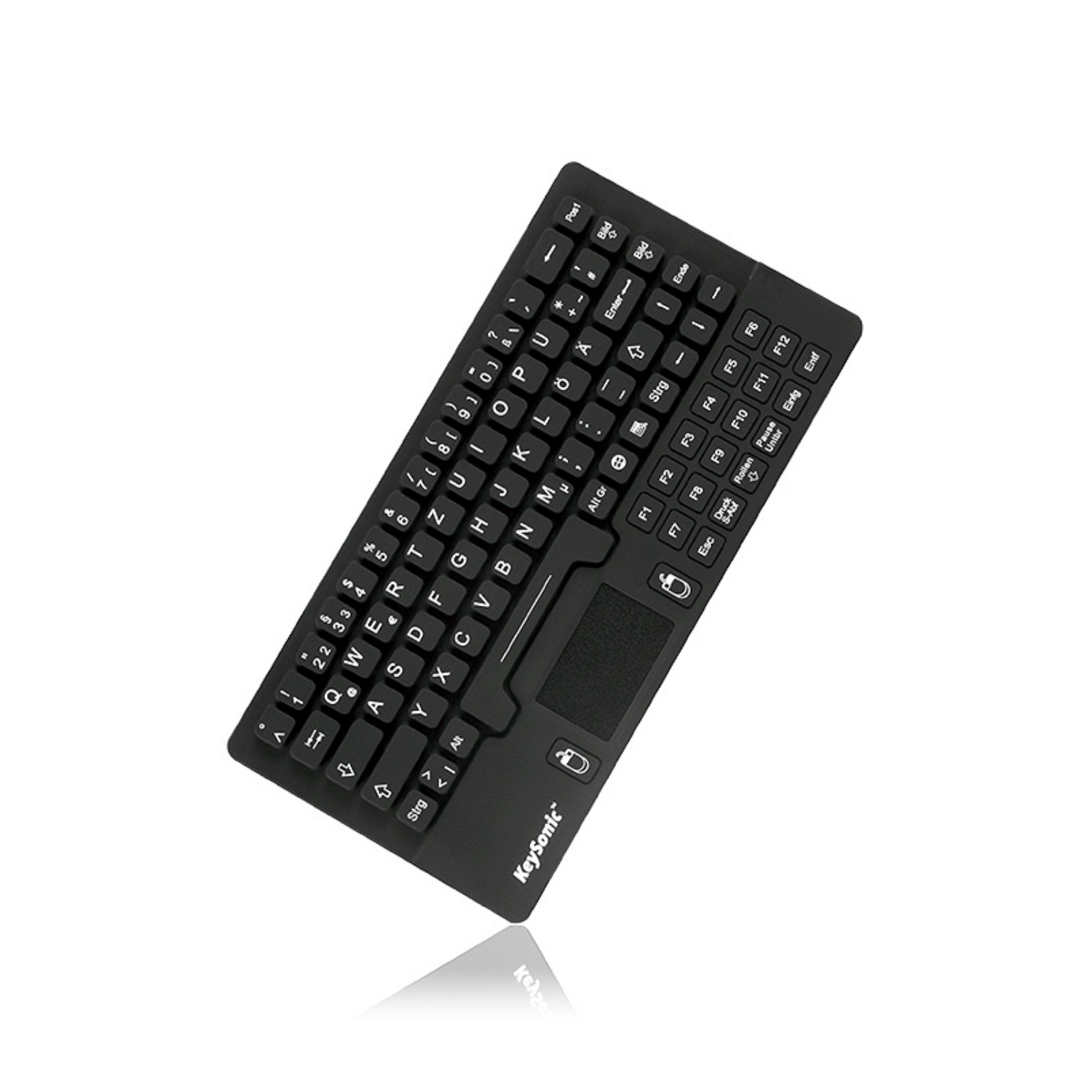 Teclado compacto negro con panel táctil, sobre fondo blanco.