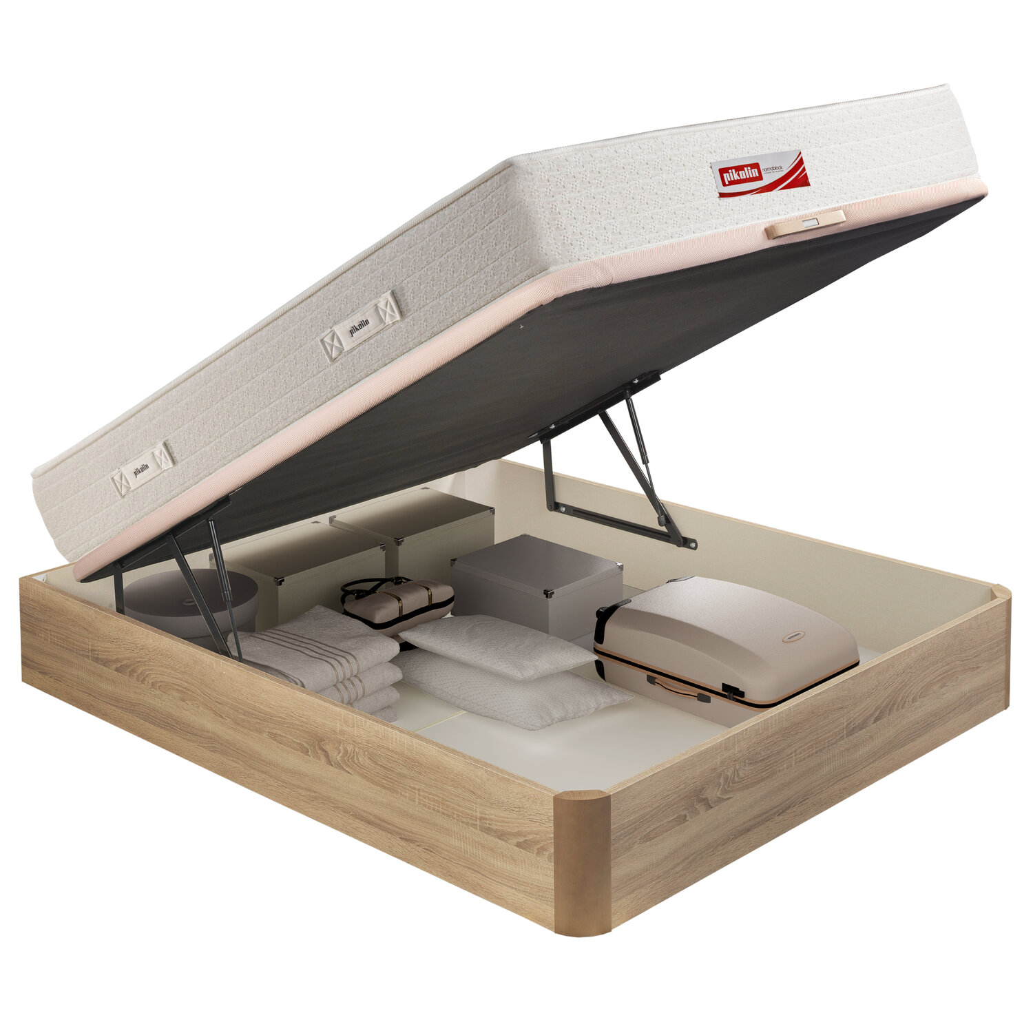 Base de cama canapé abierta revela almacenamiento con toallas, almohadas y maleta.