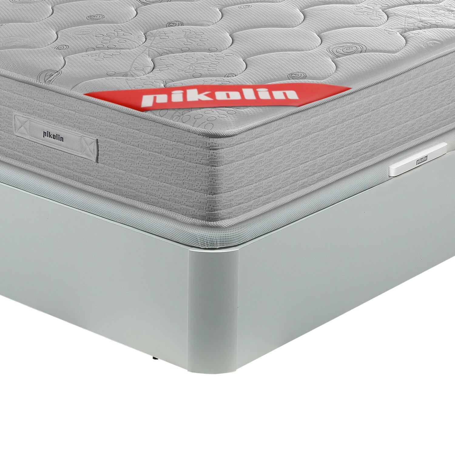 Colchón gris con patrón y logo rojo "pikolin" en una base de cama azul claro.