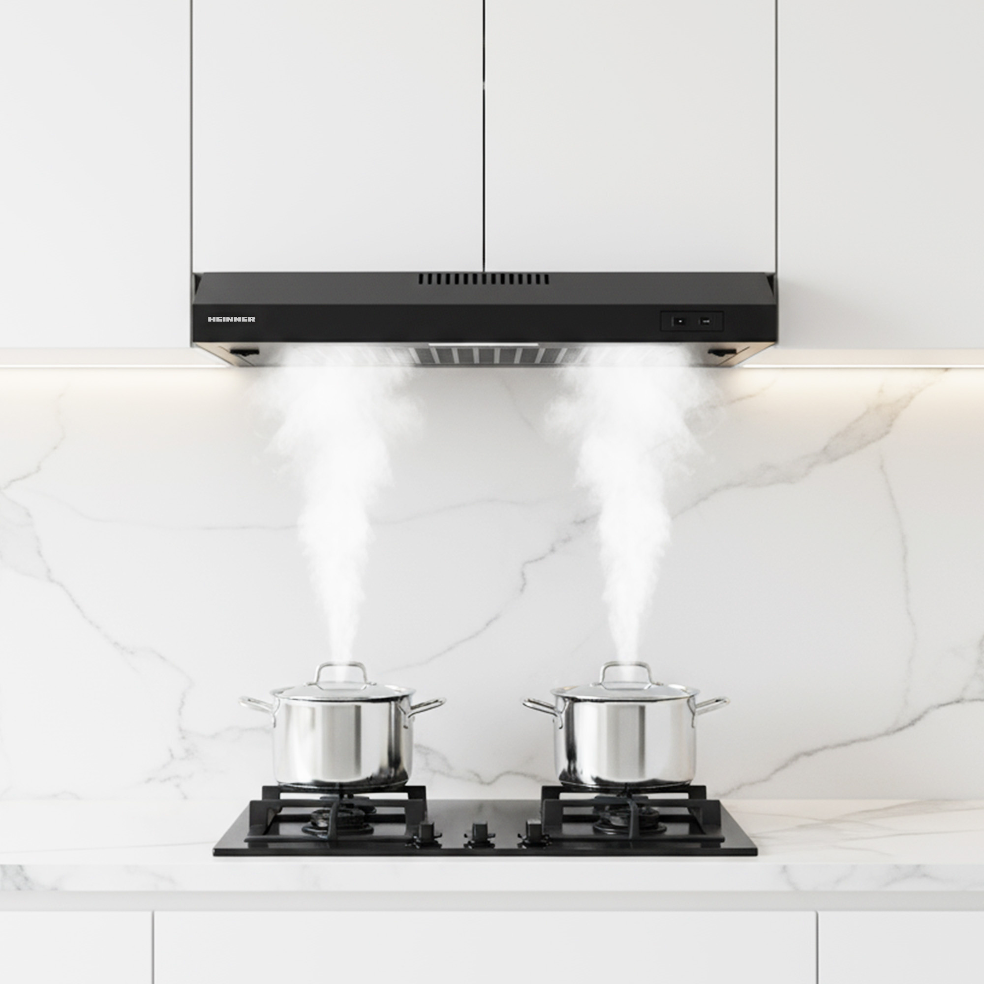 Two pots on a gas hob, steam rising, with an extractor hood above.