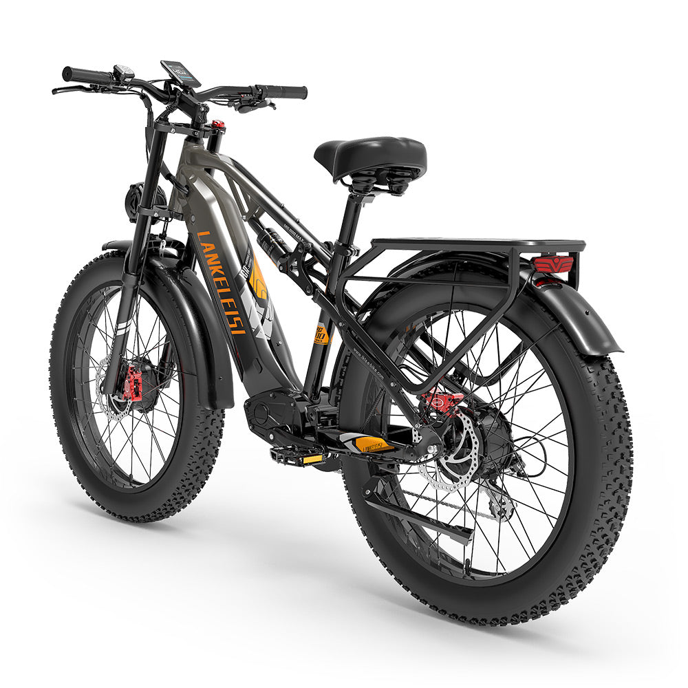 Una bicicleta eléctrica fat de color gris con neumáticos anchos, portaequipajes trasero.