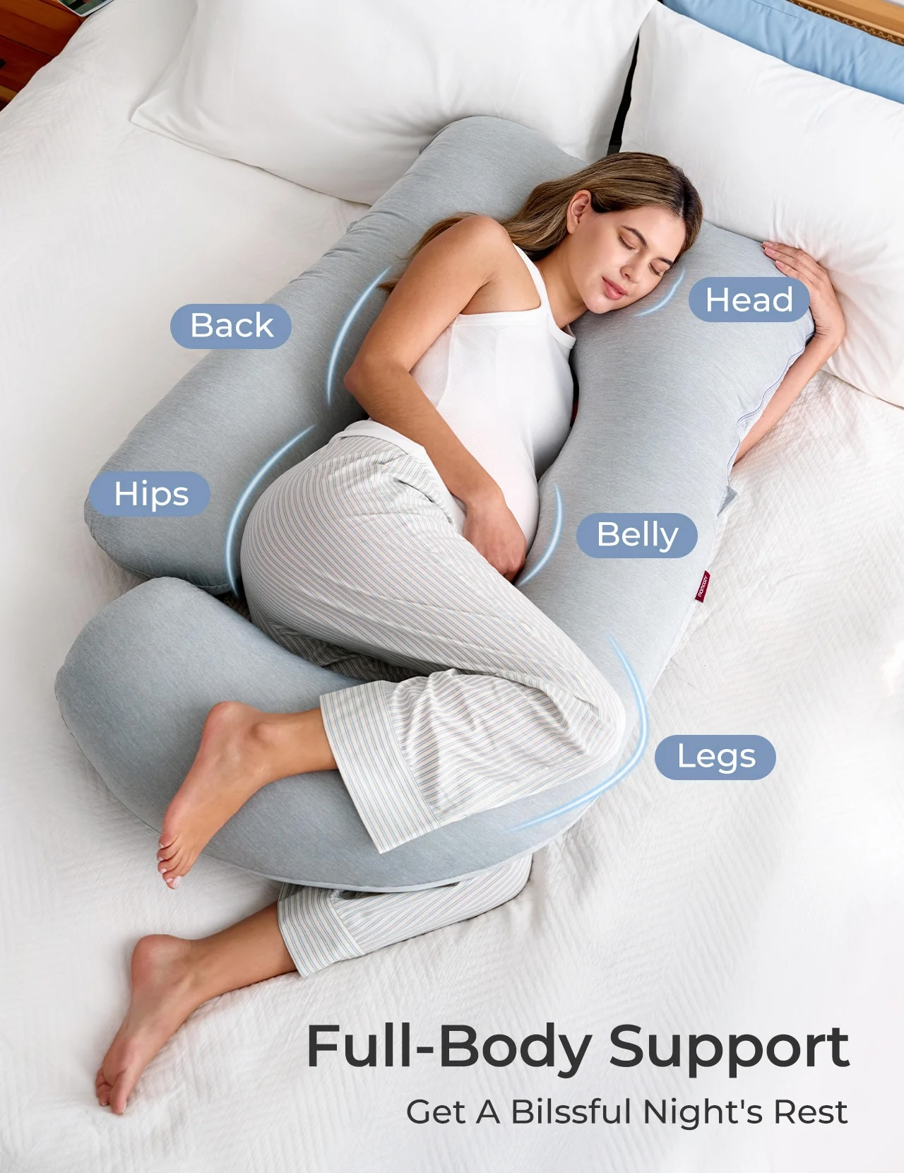 Femme enceinte dormant sur un oreiller en U offrant soutien tête, ventre, dos et jambes.