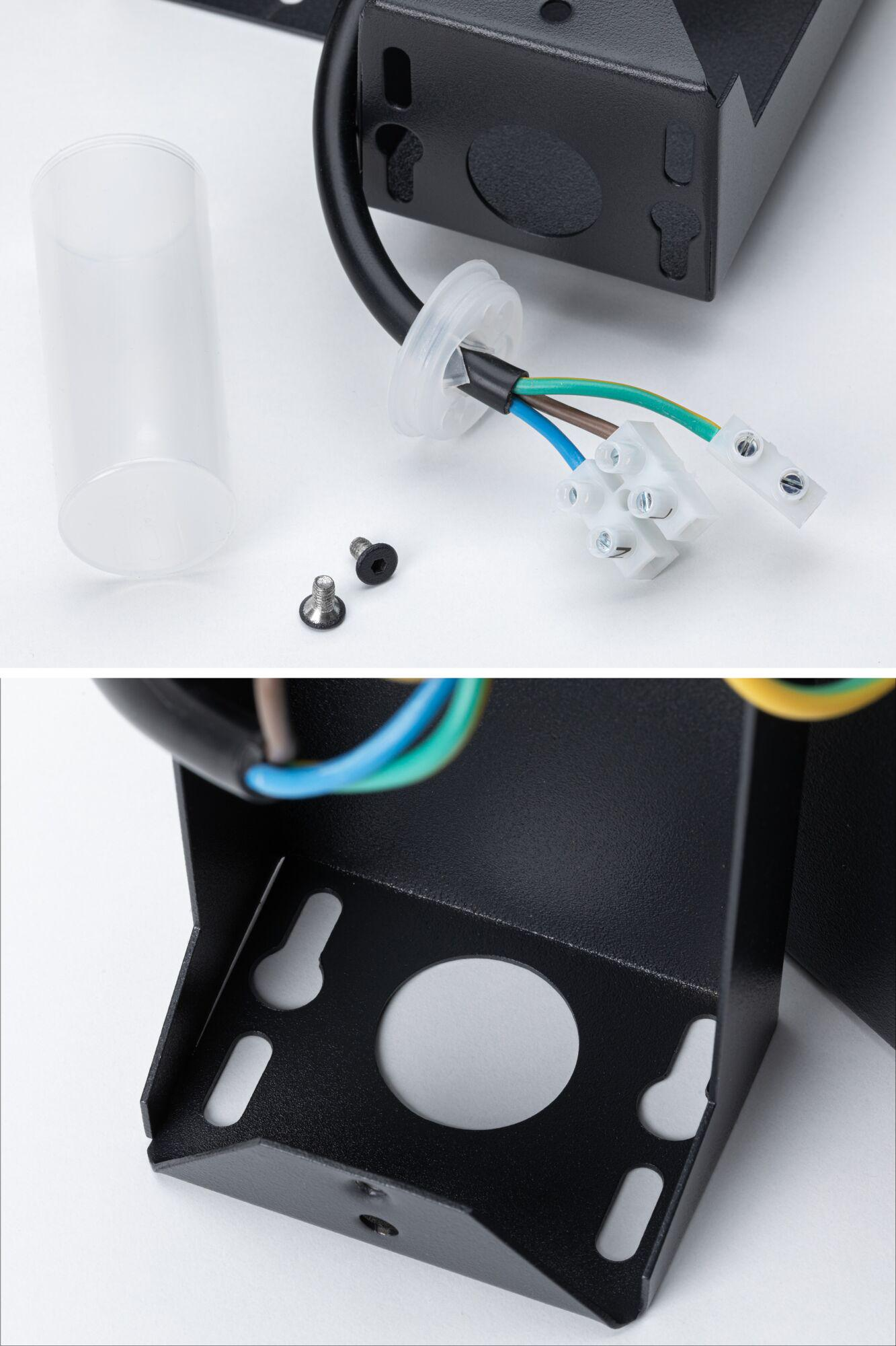 Czarna metalowa obudowa z przewodami, śrubami i szklanym cylindrem.