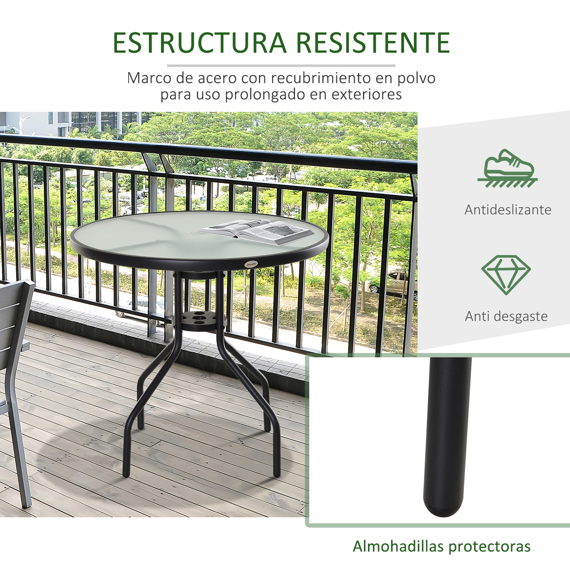 Mesa redonda de cristal con marco de metal negro sobre tarima de madera.
