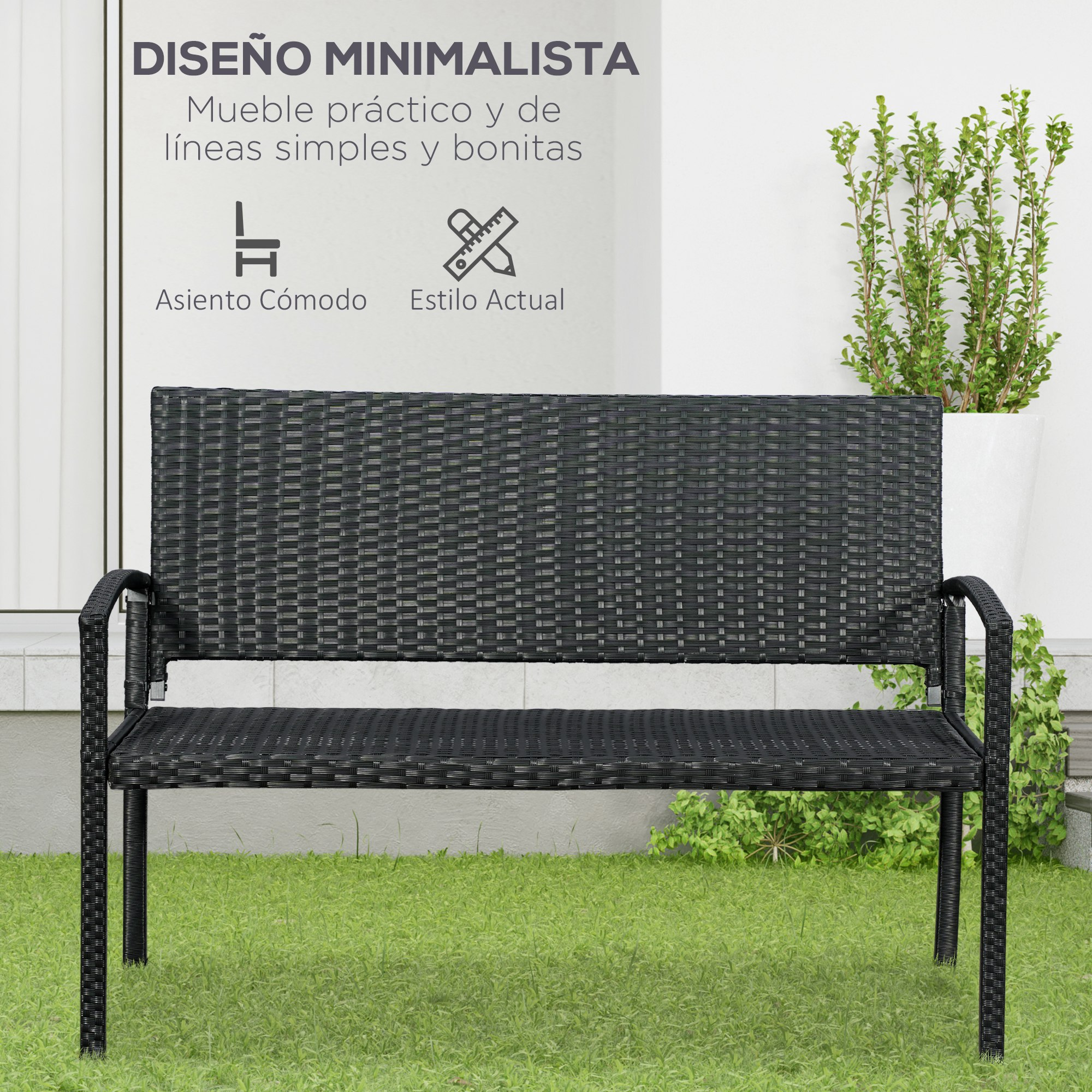 Banco de ratán negro sobre césped frente a pared blanca con planta.