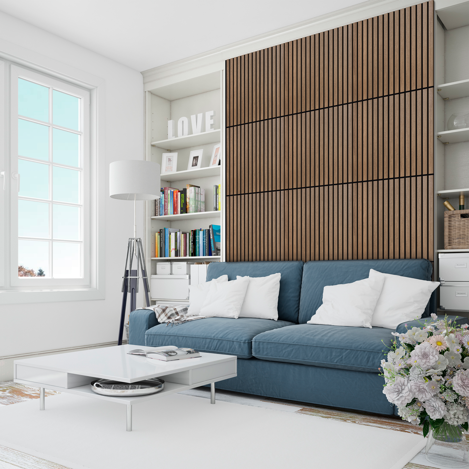 Un sofá azul con cojines blancos frente a un panel de madera y una estantería.