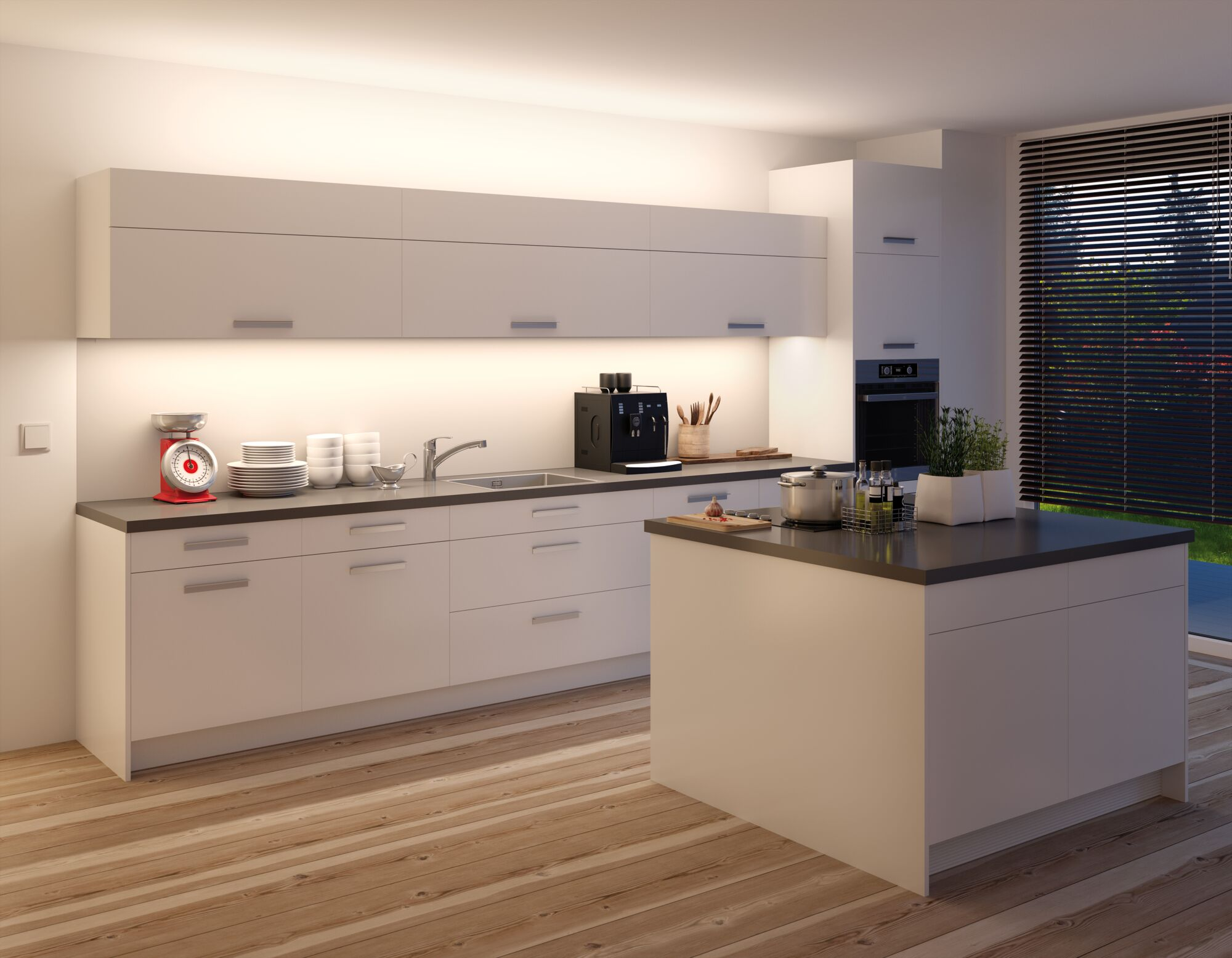 Nowoczesna biała kuchnia z wyspą, ekspresem do kawy, wagą i kuchenką.