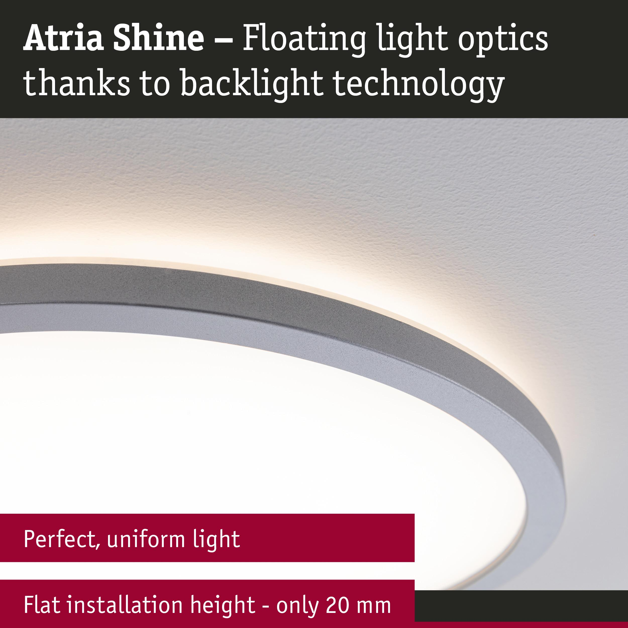 Okrągła, płaska lampa sufitowa z srebrną krawędzią emitująca jasne światło.