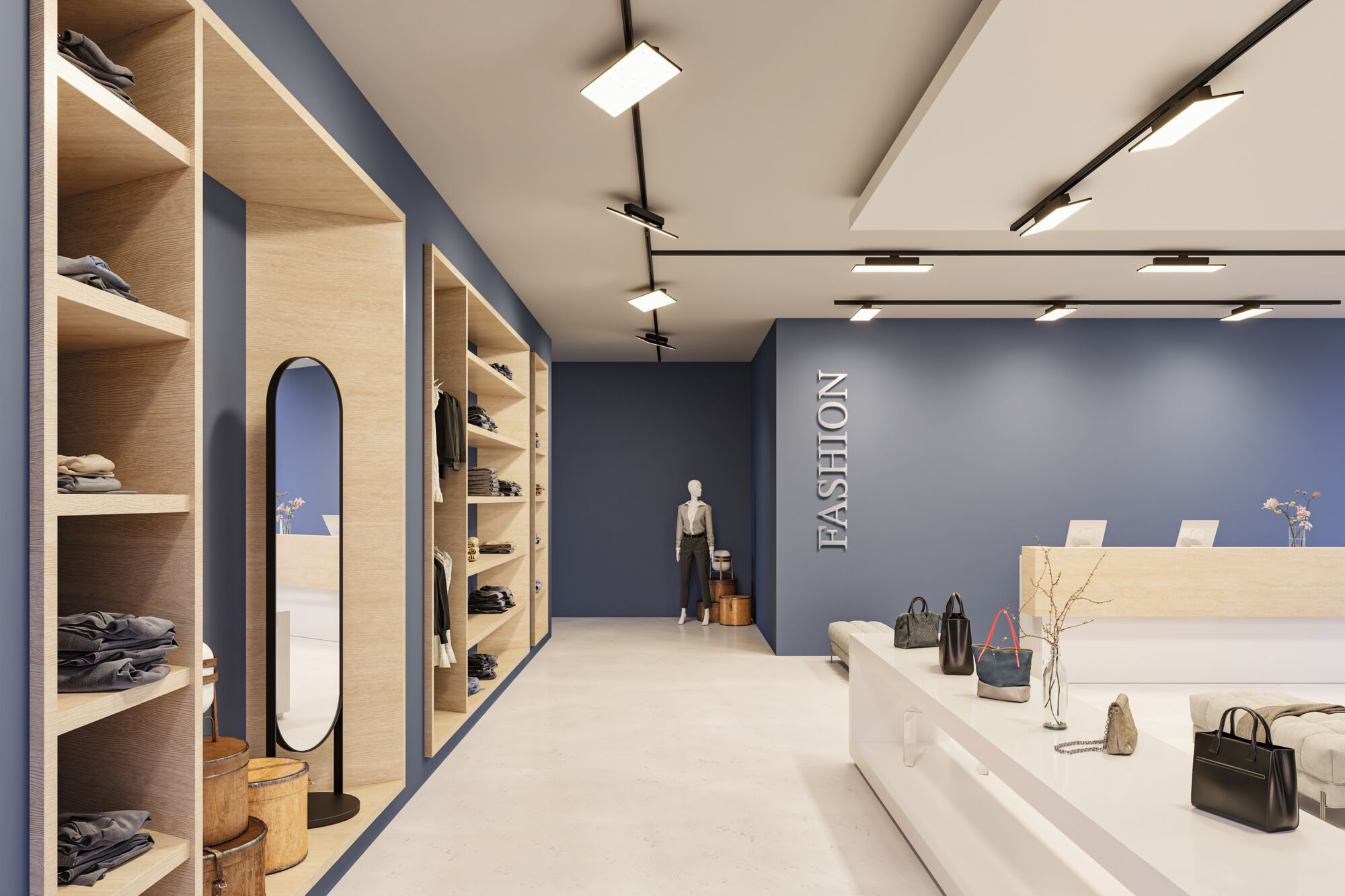 Jasny, nowoczesny sklep odzieżowy z półkami i wystawami.