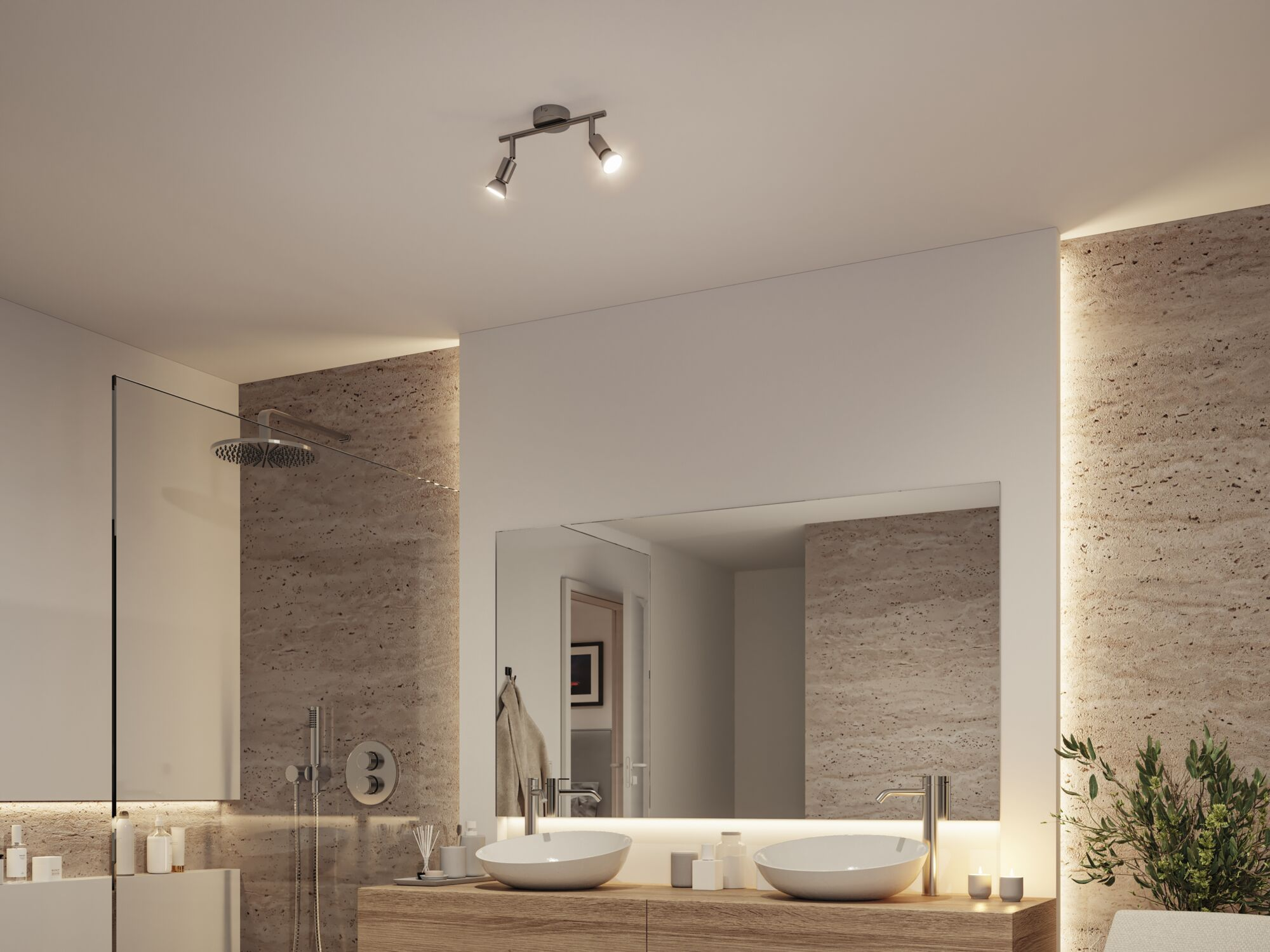 Modernes Badezimmer mit Doppelwaschbecken, Dusche und beleuchteten Akzenten.