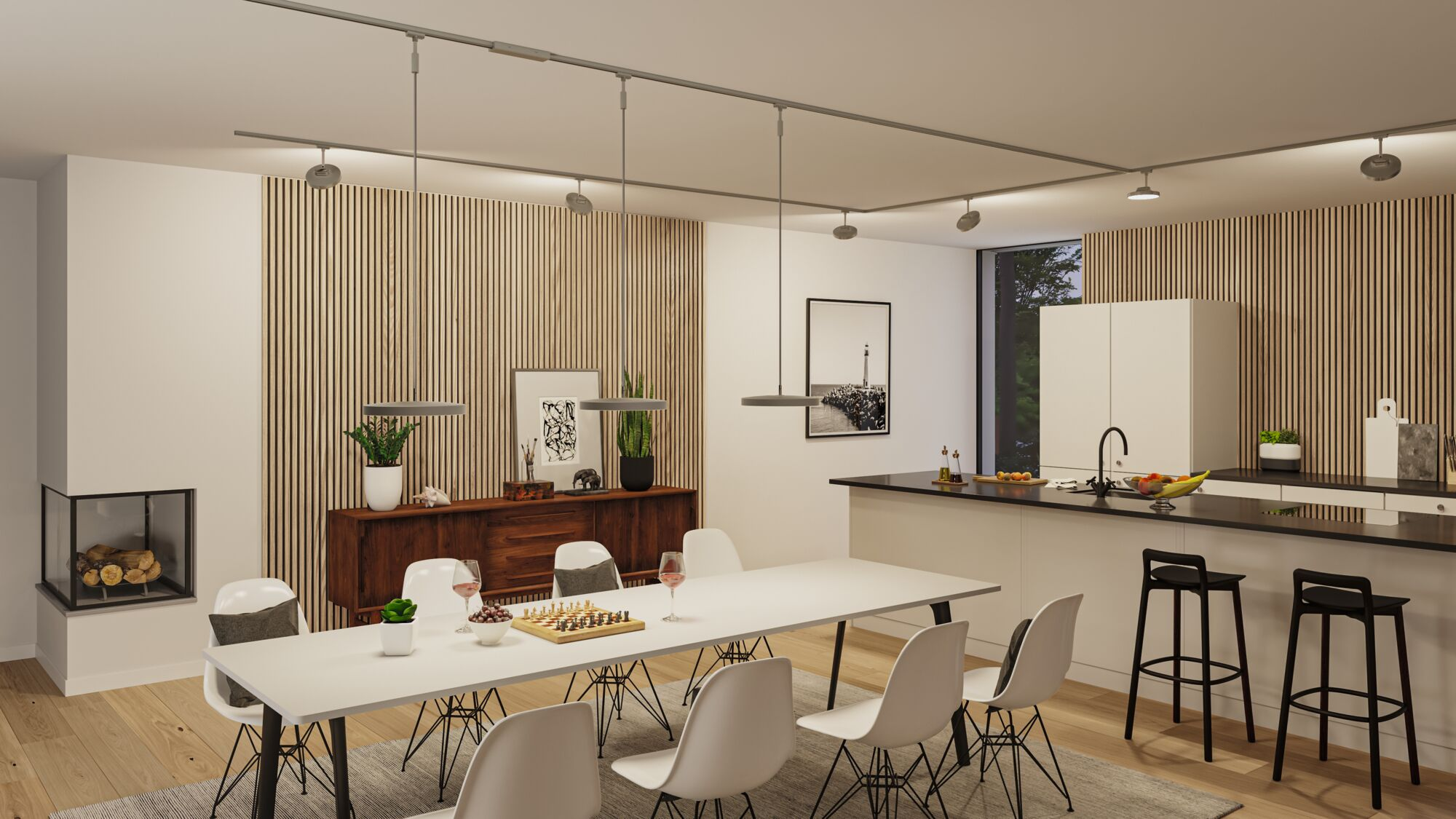 Ein Esszimmer und eine Küche mit weißen Stühlen, einem Tisch, Kamin und Holzverkleidung.