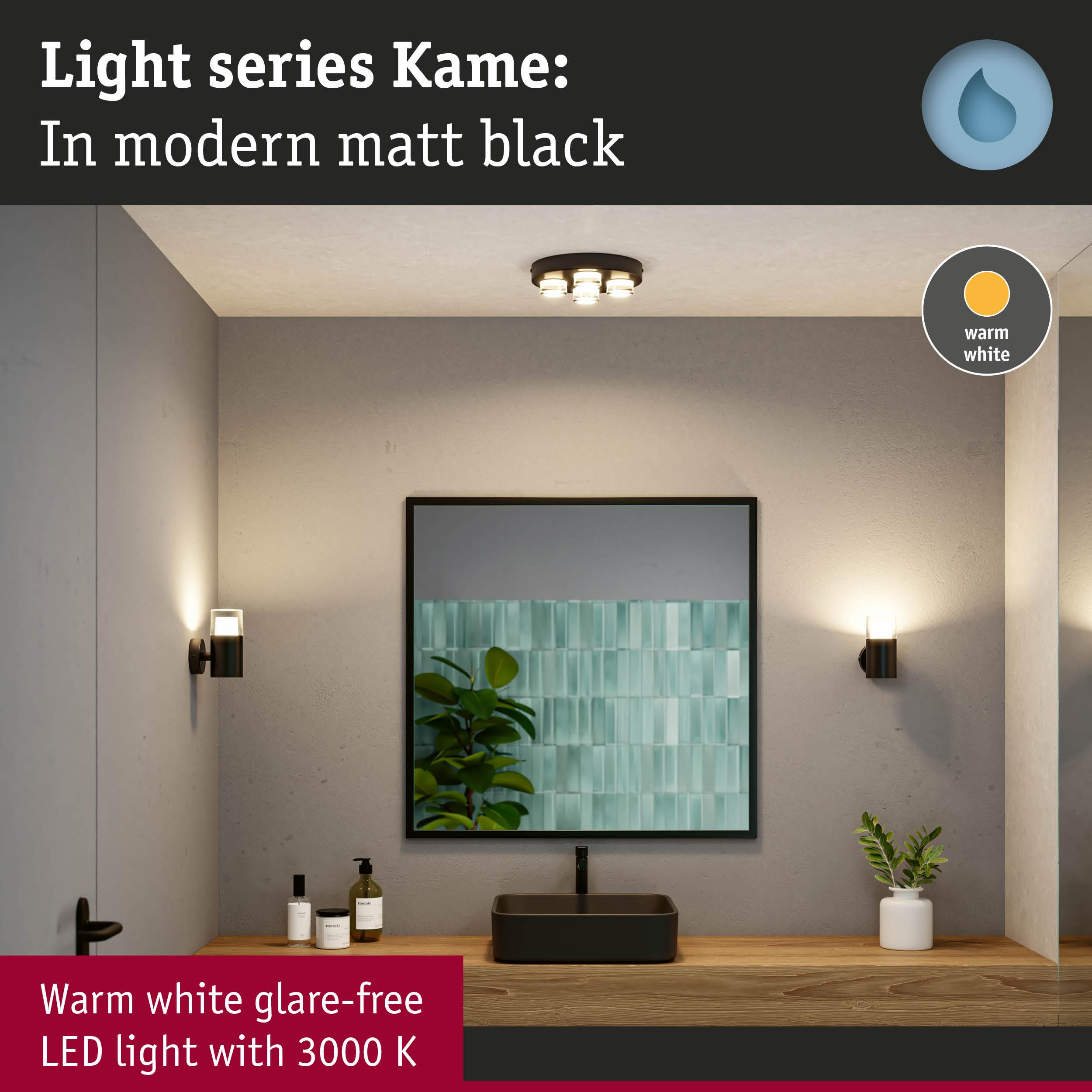 Modernes Badezimmer mit schwarzem Waschbecken, Spiegel und warmweißer Beleuchtung.