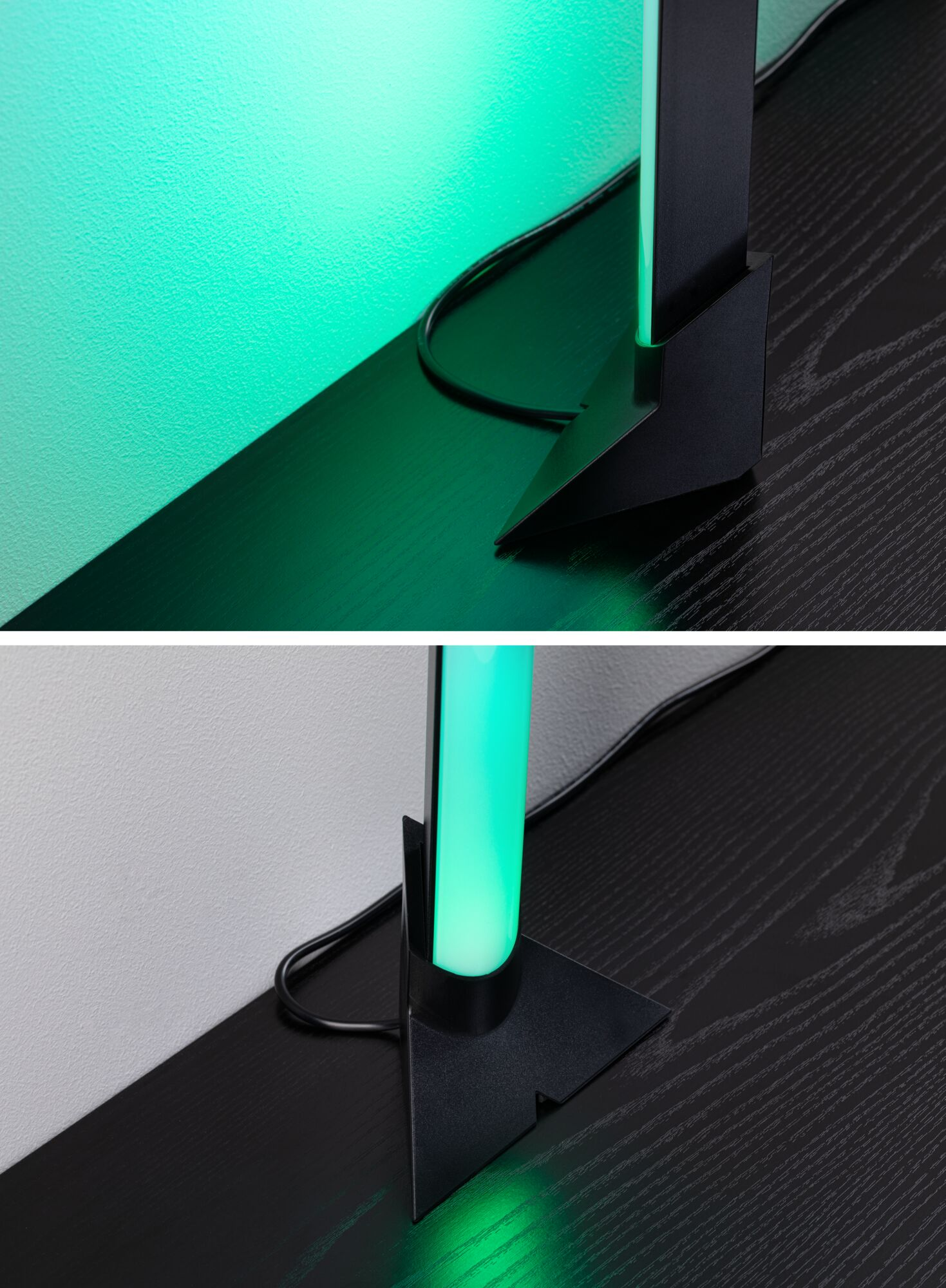 Una base di lampada nera con illuminazione verde su un tavolo di legno.