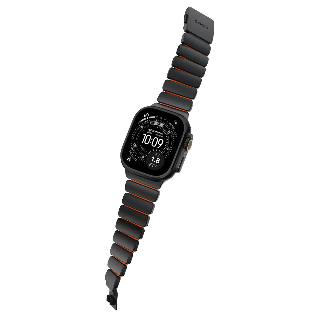 Eine schwarze Nomad Apple Watch mit orange akzentuiertem Band zeigt 10:09.