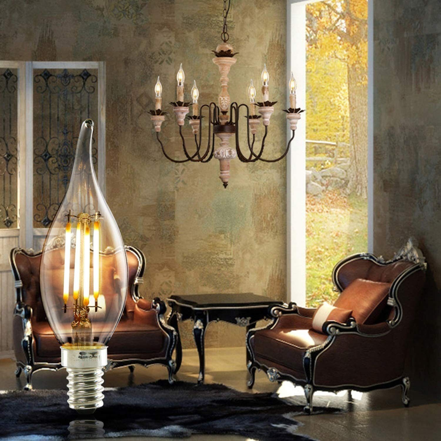 Una lampadina Edison si trova davanti a due poltrone in pelle marrone, un tavolo e un lampadario.