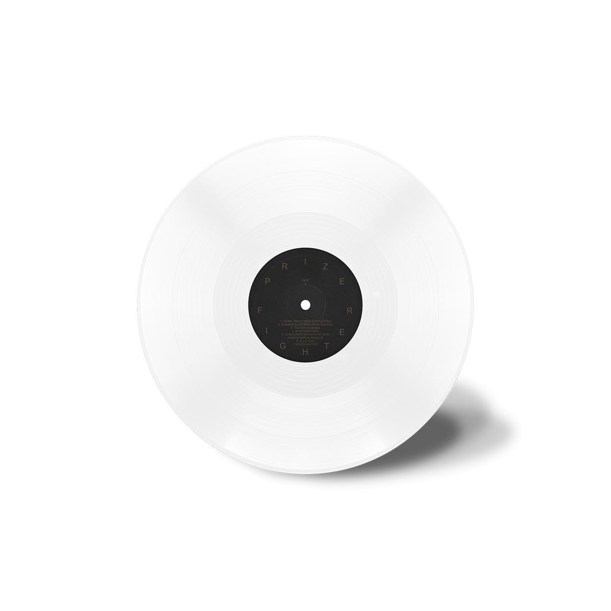 Un disco in vinile bianco con etichetta nera e titoli di canzoni in cerchio.