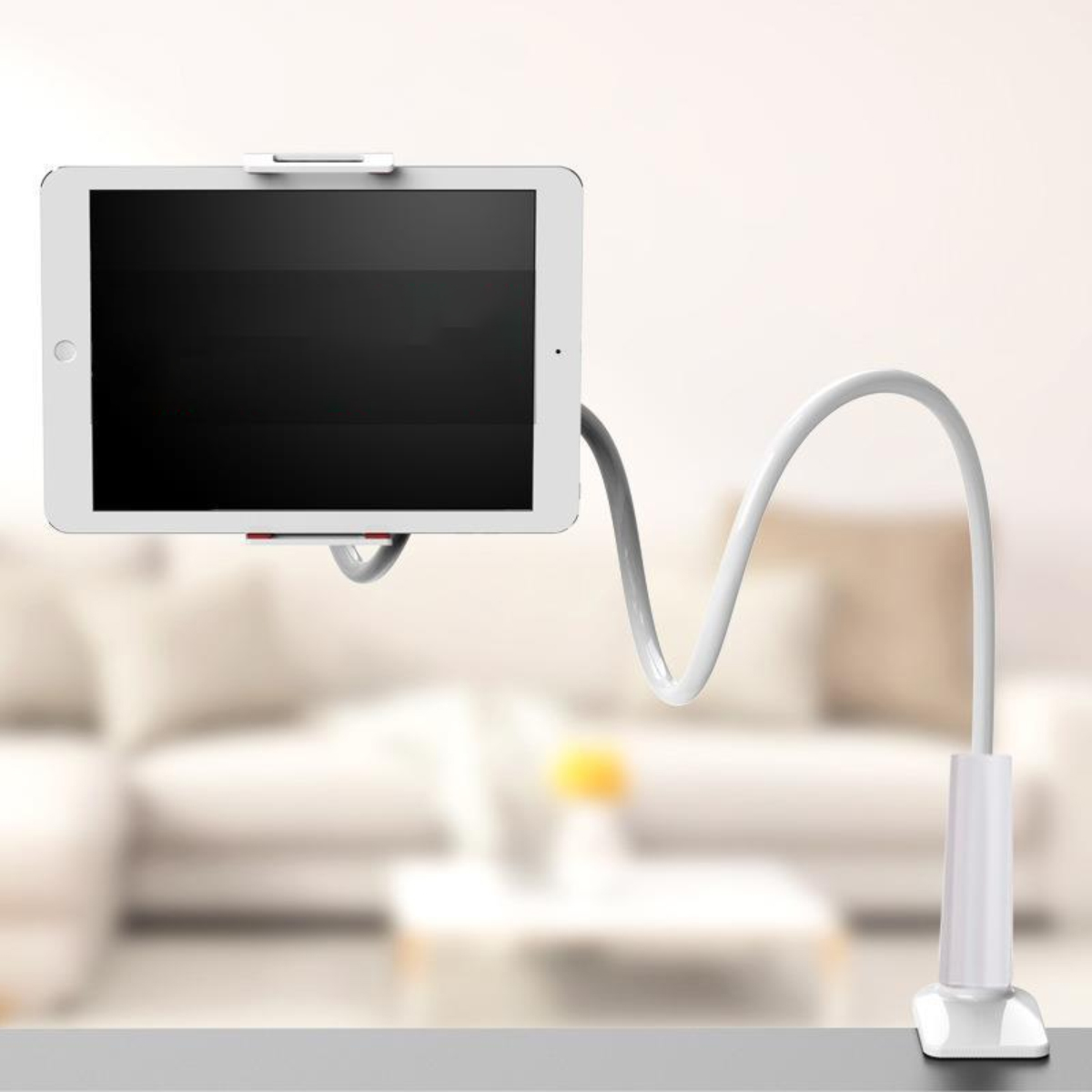 Ein weißes Tablet auf einem flexiblen, weißen Arm, der an einem Clip befestigt ist.