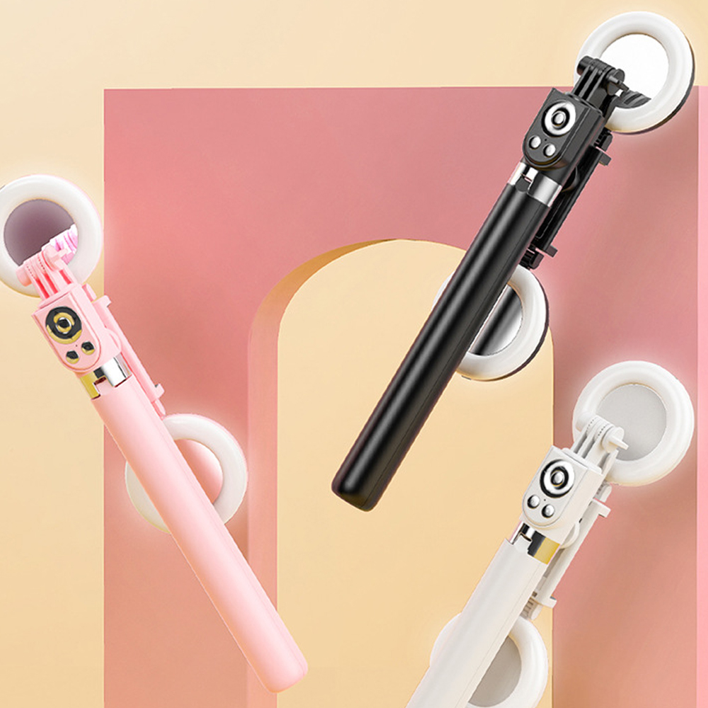 Drei Selfie-Sticks in Rosa, Schwarz und Weiß mit Ringleuchten.