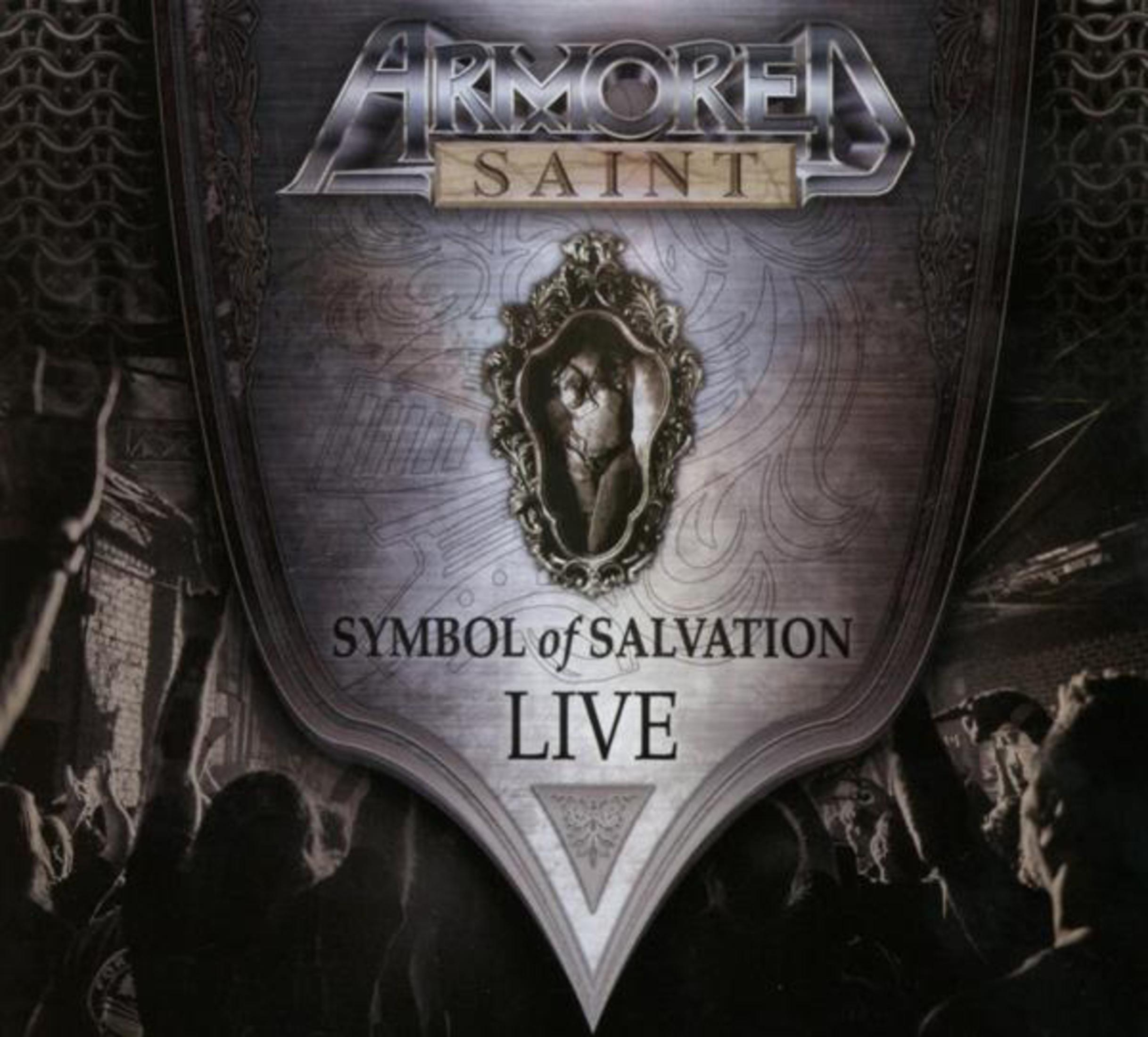 Logo della band Armored Saint sopra un medaglione e testo "Symbol of Salvation Live".