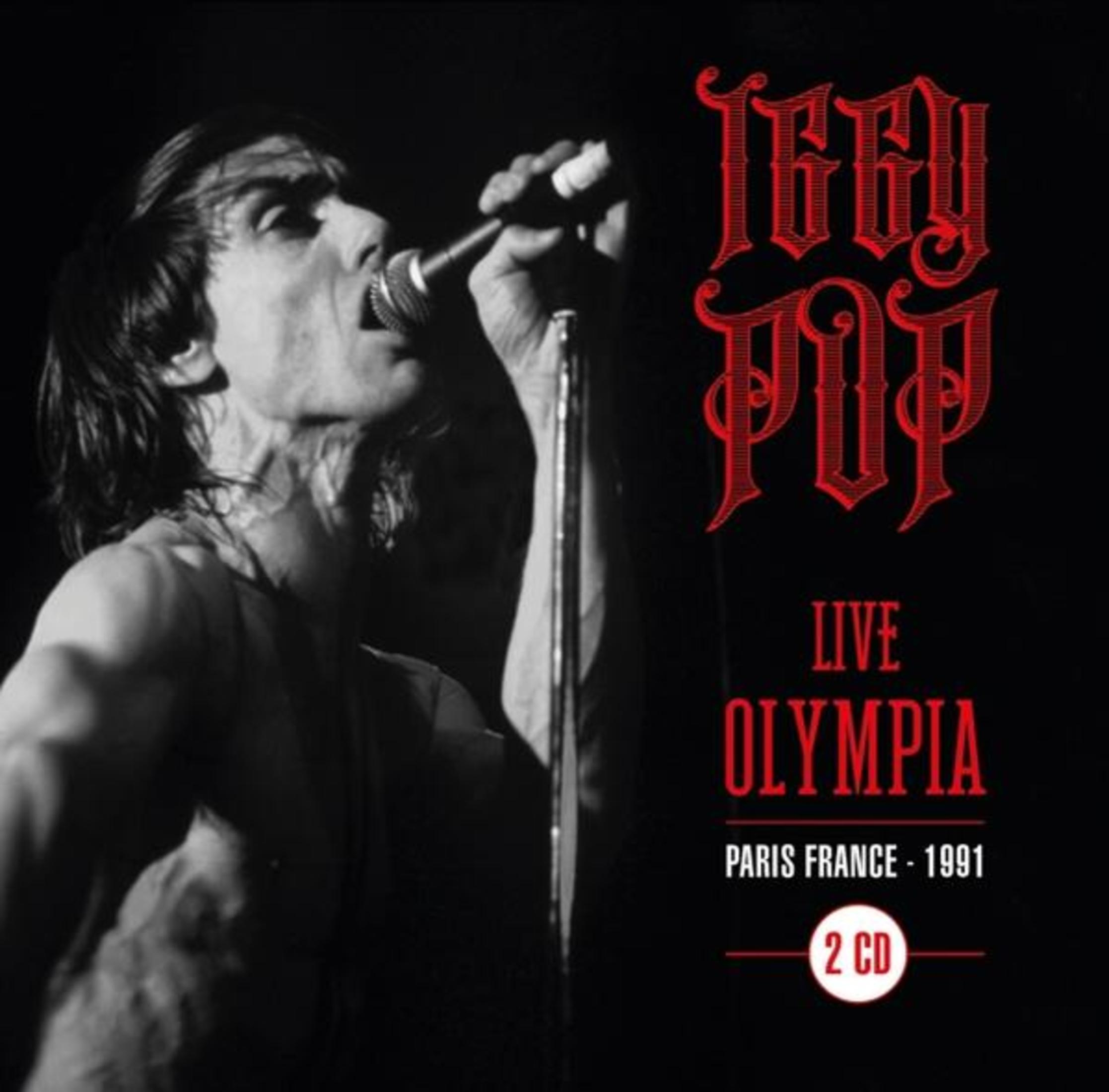 Immagine in bianco e nero di Iggy Pop che canta dal vivo all'Olympia, Parigi nel 1991.