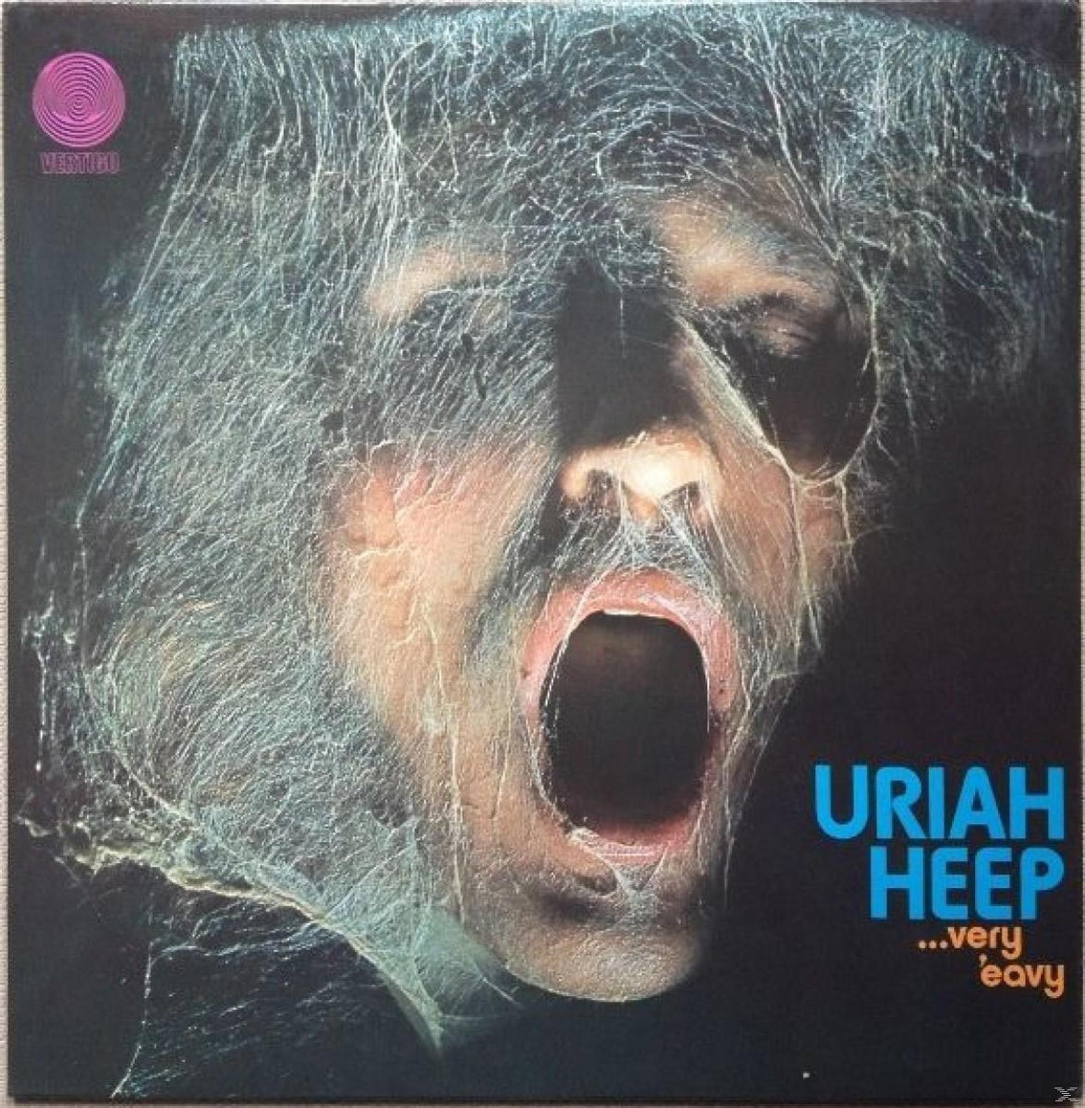 Uomo con bocca aperta, coperto di ragnatele. Copertina album Uriah Heep.