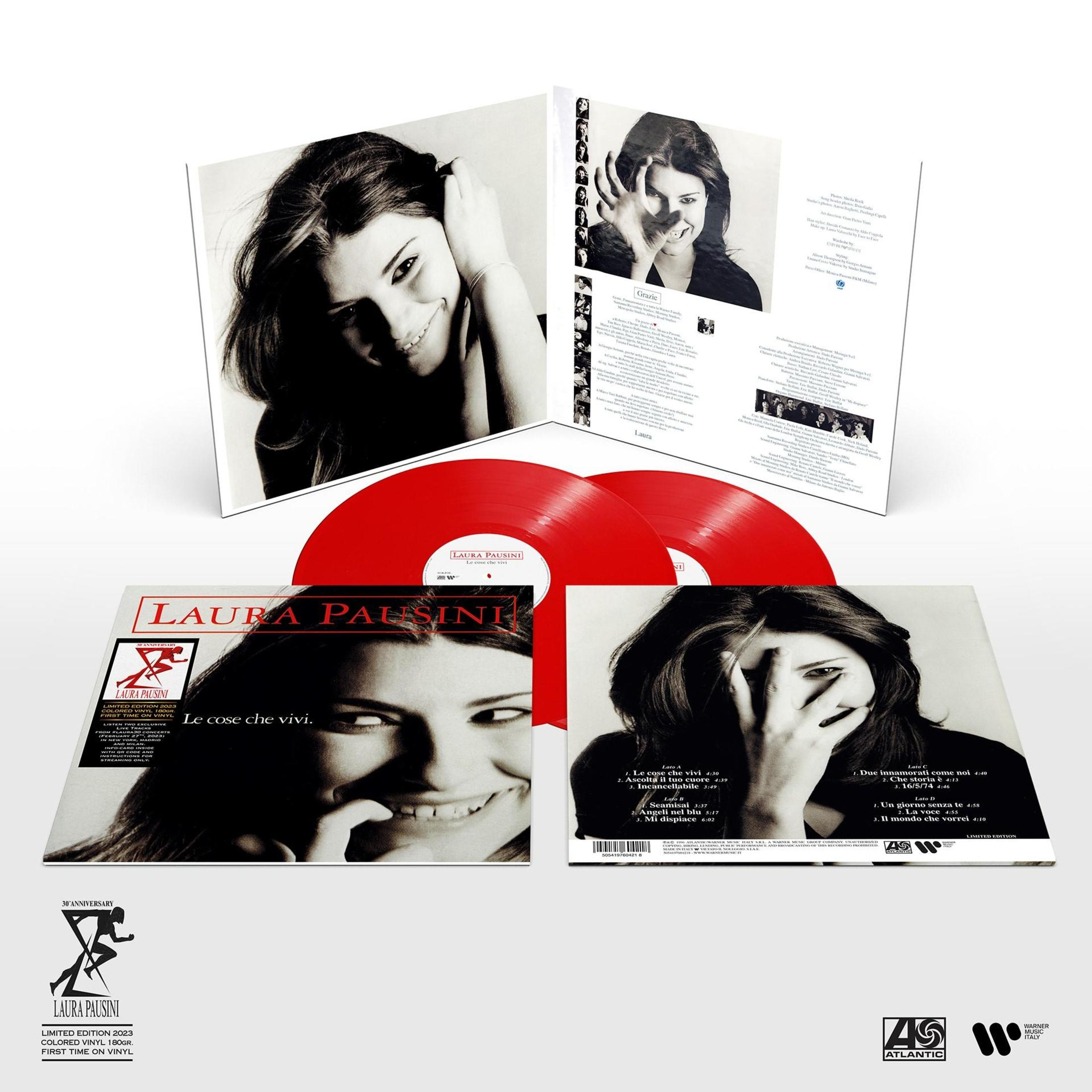 Un album in vinile di Laura Pausini, "Le cose che vivi," con dischi rossi e foto di copertina in bianco e nero.