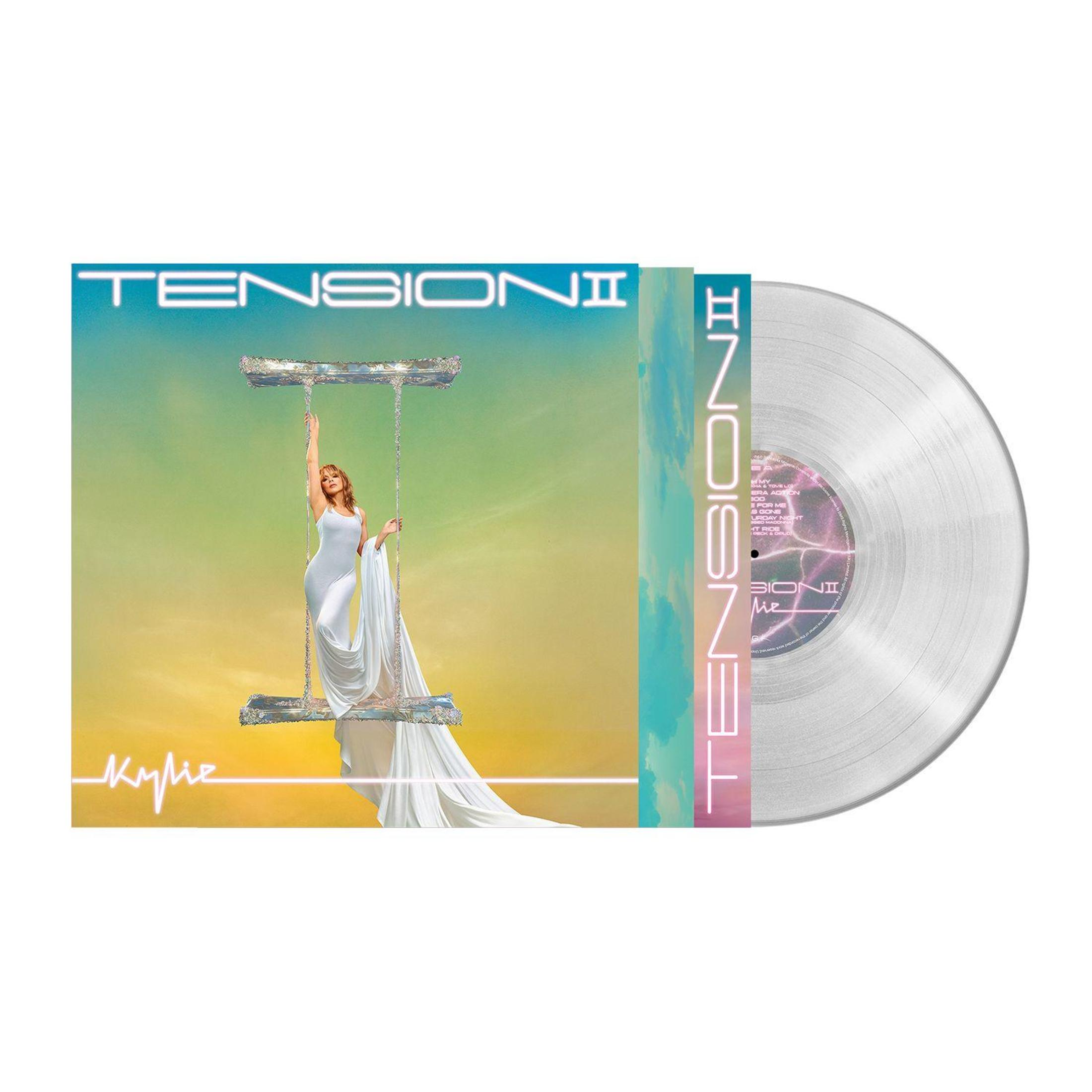Kylie Minogue su un'altalena contro un cielo sfumato e un disco in vinile.