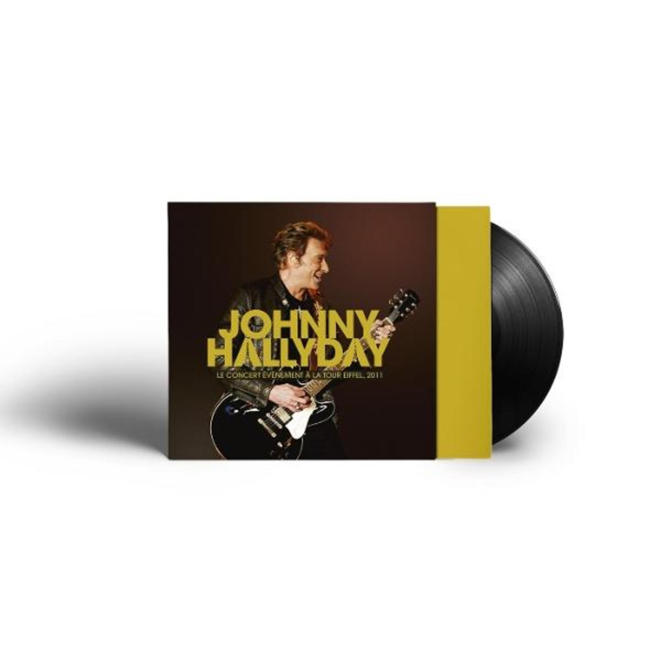 Johnny Hallyday con chitarra sulla copertina dell'album, accanto a un disco in vinile.